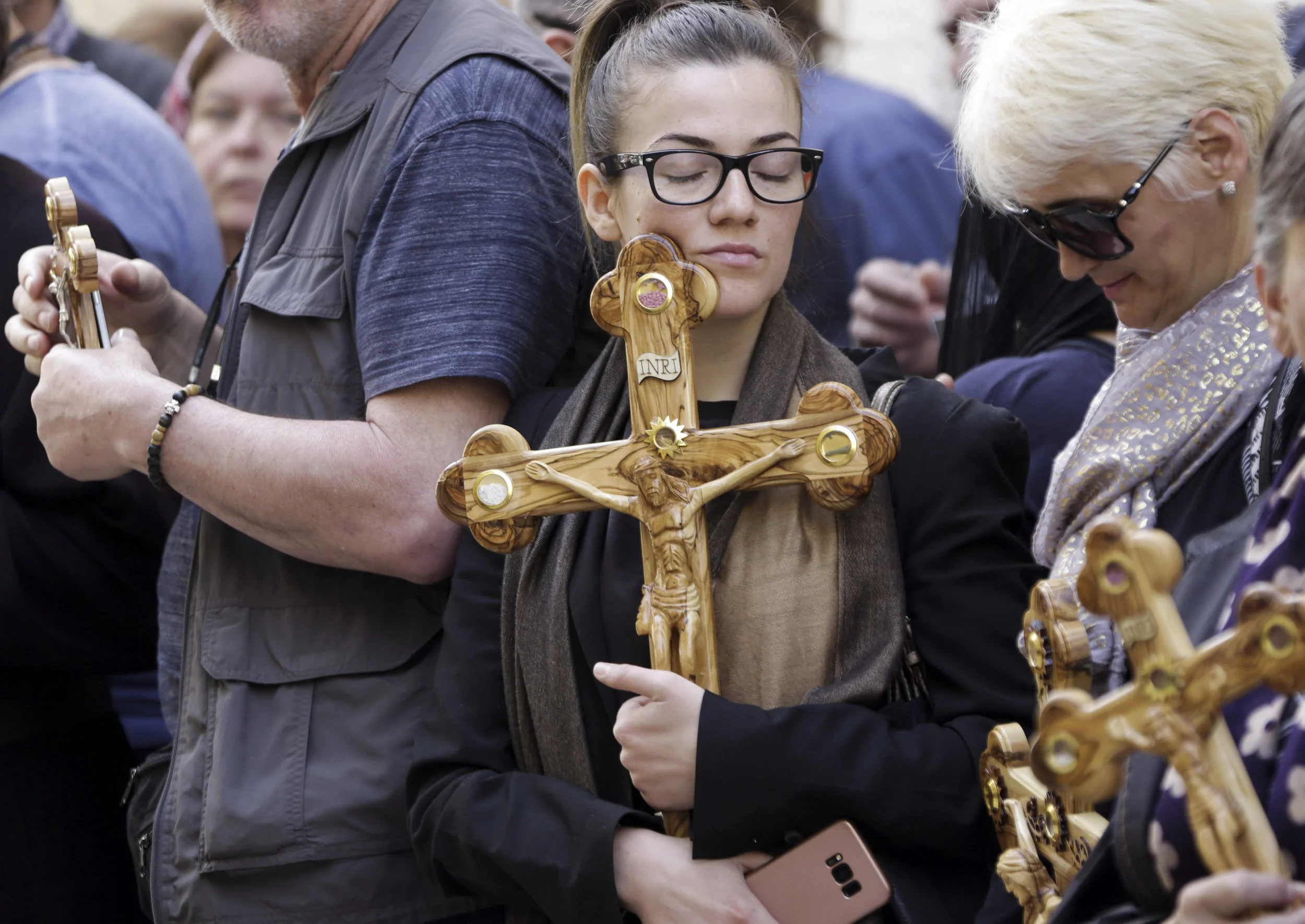 Orthodox pilgrims hold crosses during a Good Friday procession in Jerusalem, Friday, April 26, 2019. (AP Photo/Mahmoud Illean)