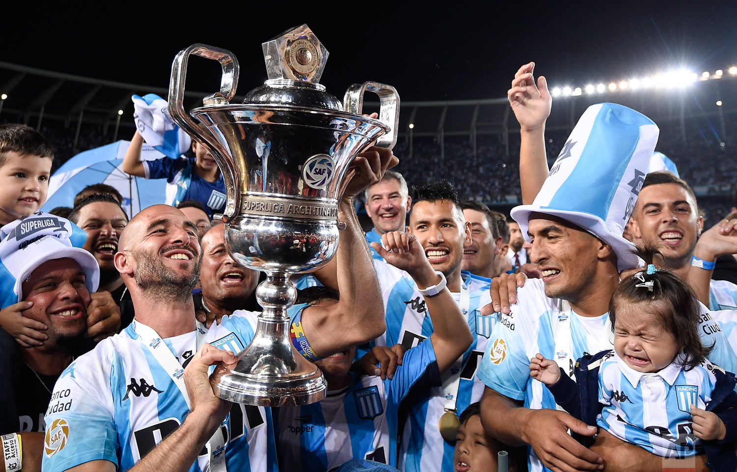Racing Club players celebrate their national league trophy after defeating Defensa y Justicia in Buenos Aires, Argentina, April 7, 2019. (AP Photo/Gustavo Garello)