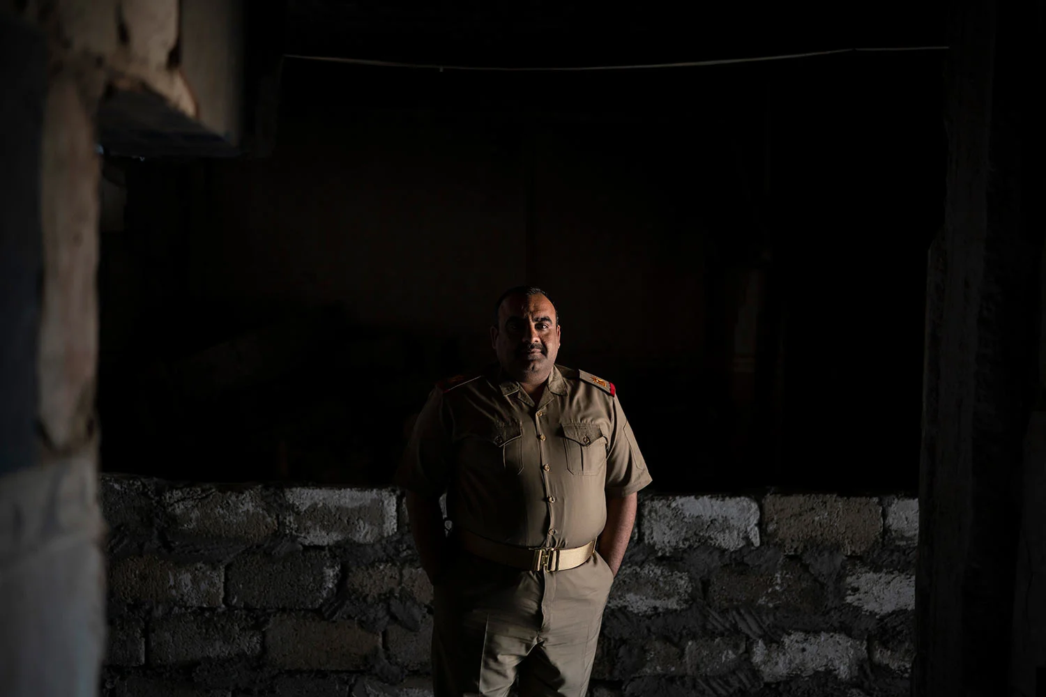 In this April 9, 2019 photo, Iraqi army 20th division Major Khalid Abdullah poses for a portrait in Badoush, Iraq. His battalion is permanently based in the area as a peace keeping force. They man checkpoints and carry out raids to identify and arrest remaining Islamic State militants. (AP Photo/Felipe Dana)