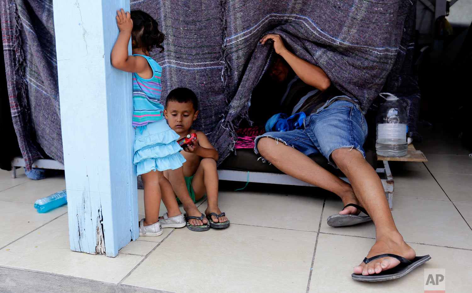 Migrants seeking asylum in the United States wait at a shelter in Reynosa, Mexico, May 1, 2019. (AP Photo/Eric Gay)
