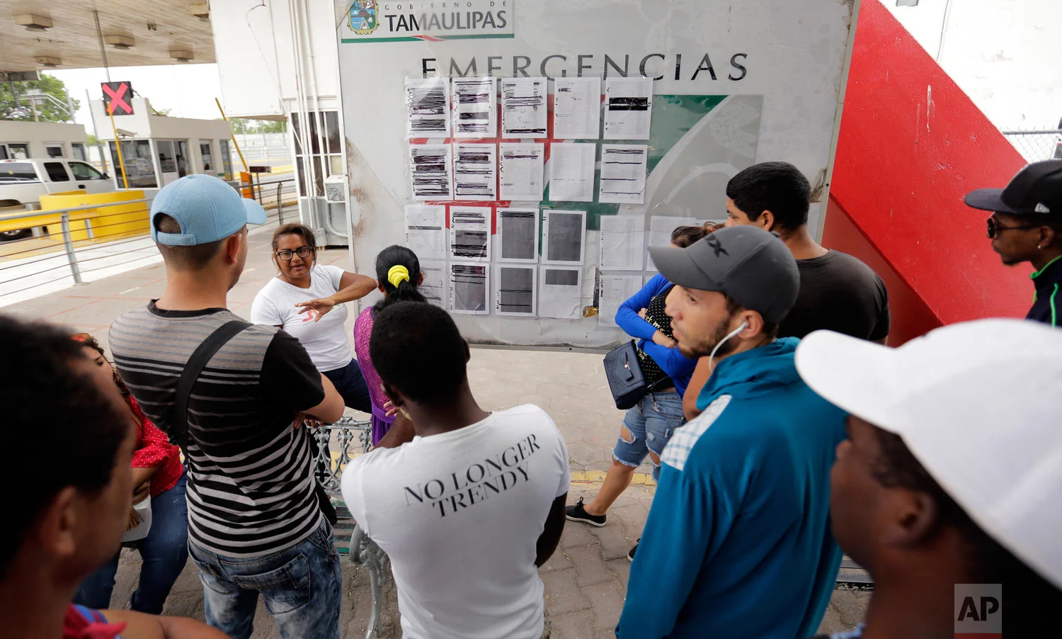 Migrants seeking asylum in the United States wait next to a list for asylum near the international bridge in Matamoros, Mexico, April 30, 2019. (AP Photo/Eric Gay)