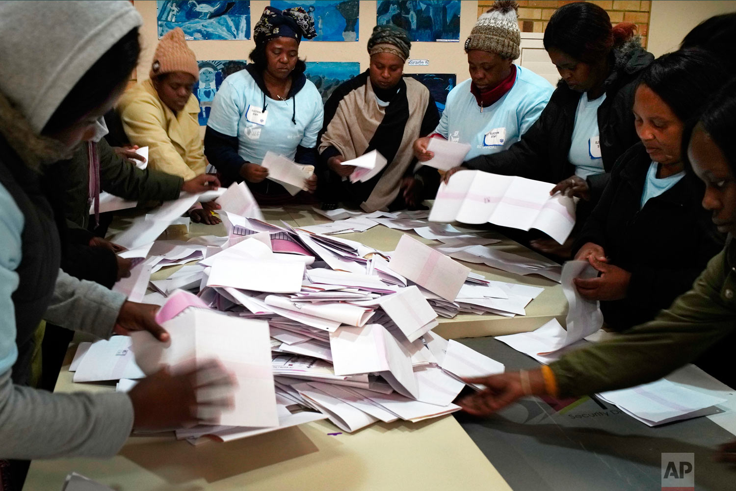 Electoral commission agents start counting the votes May 8, 2019, in Johannesburg, South Africa. (AP Photo/Jerome Delay)
