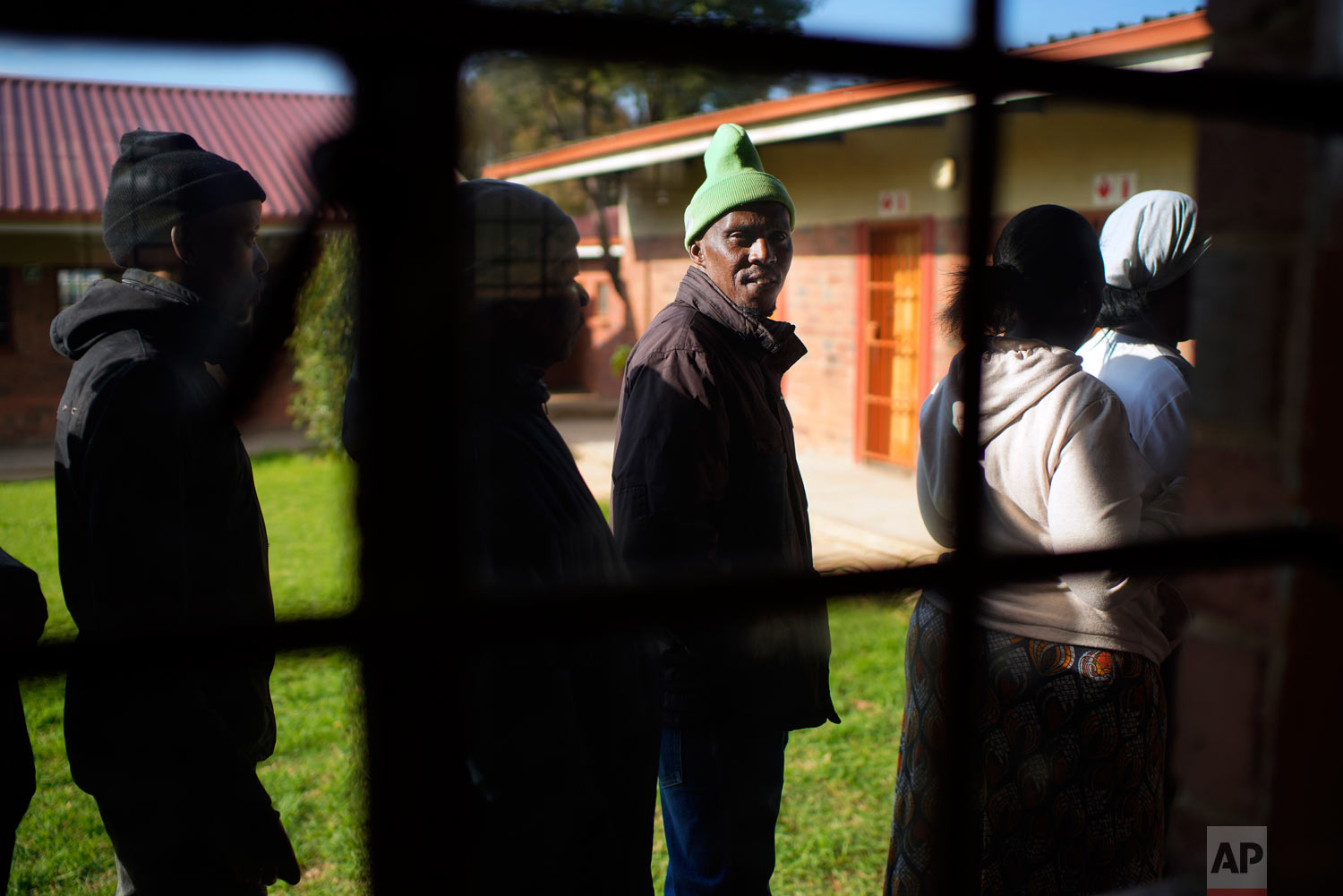 Locals line up to cast their vote May 8, 2019, general elections in Soweto, South Africa. (AP Photo/Jerome Delay)