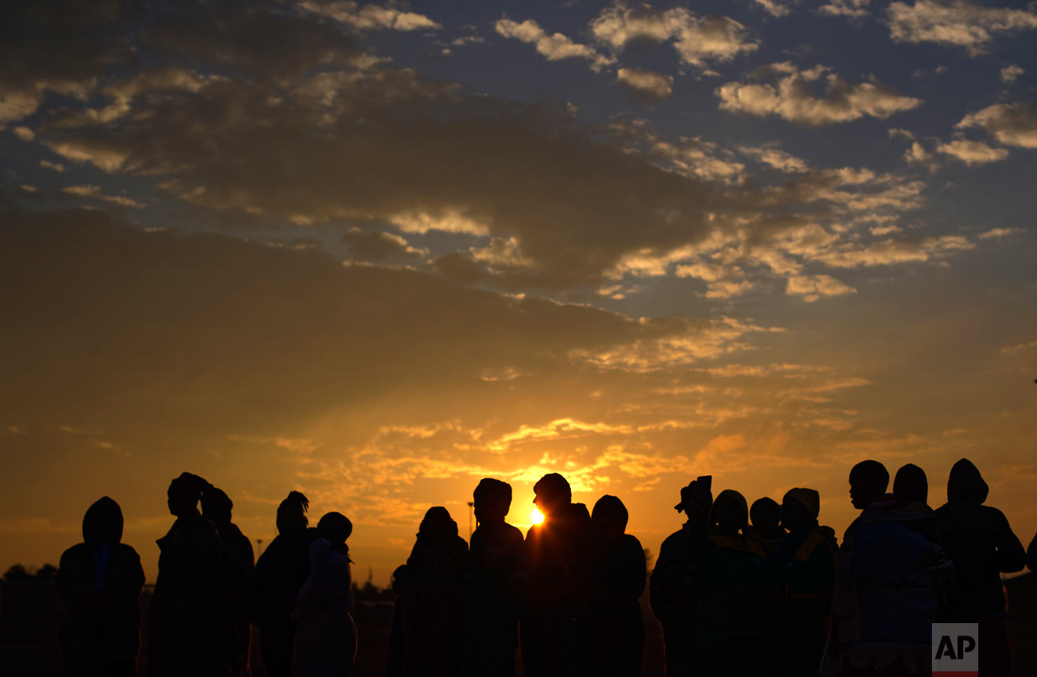 South Africans queue in the early morning cold to cast their votes in the mining settlement of Bekkersdal, west of Johannesburg, in South Africa, May 8, 2019. (AP Photo/Ben Curtis)