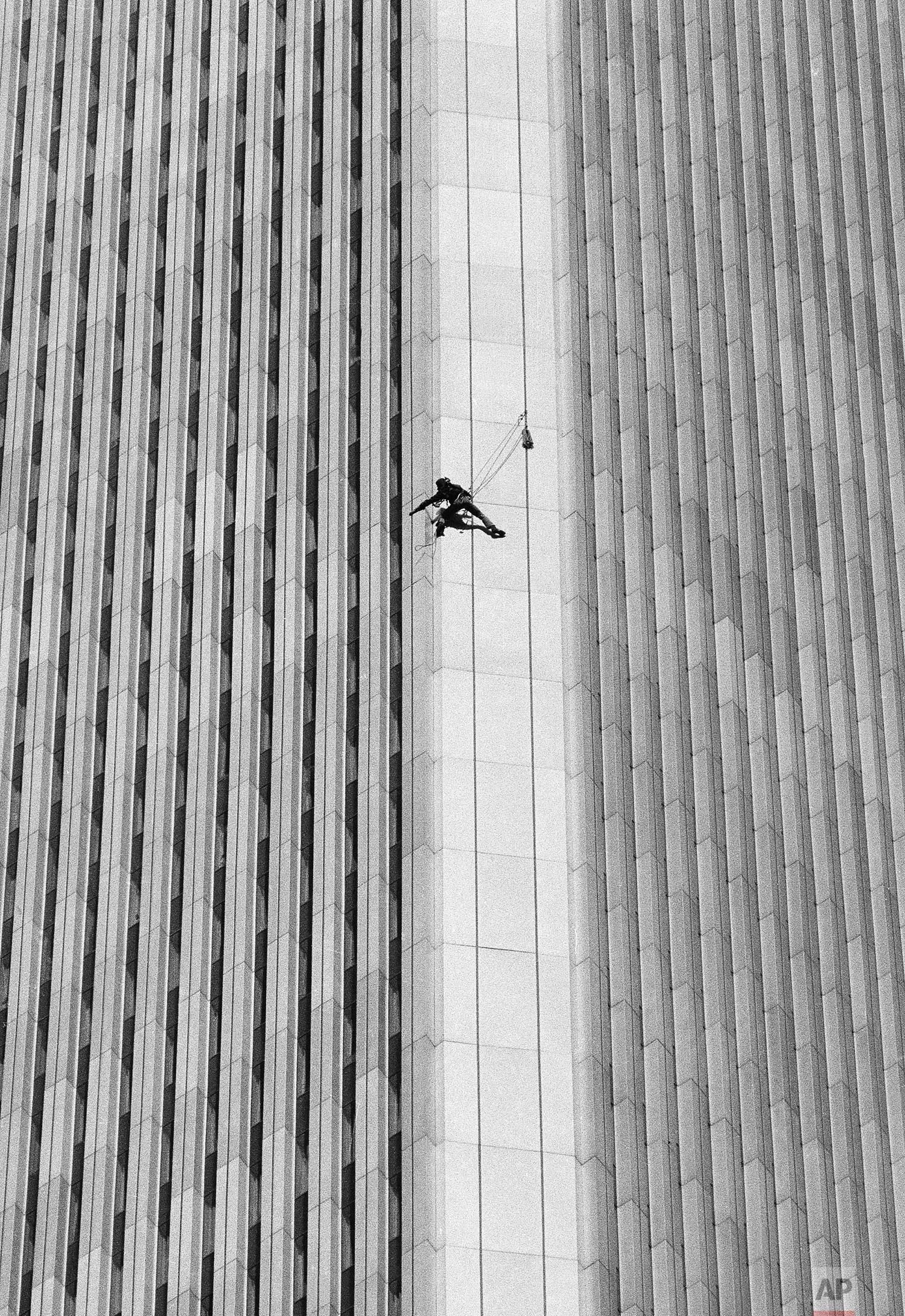 A man identified by friends as George Willig, 28, of New York, climbs the south tower of the World Trade Center in New York on Thursday, May 26, 1977. The building is 110 stories high. (AP Photo/Dave Pickoff)