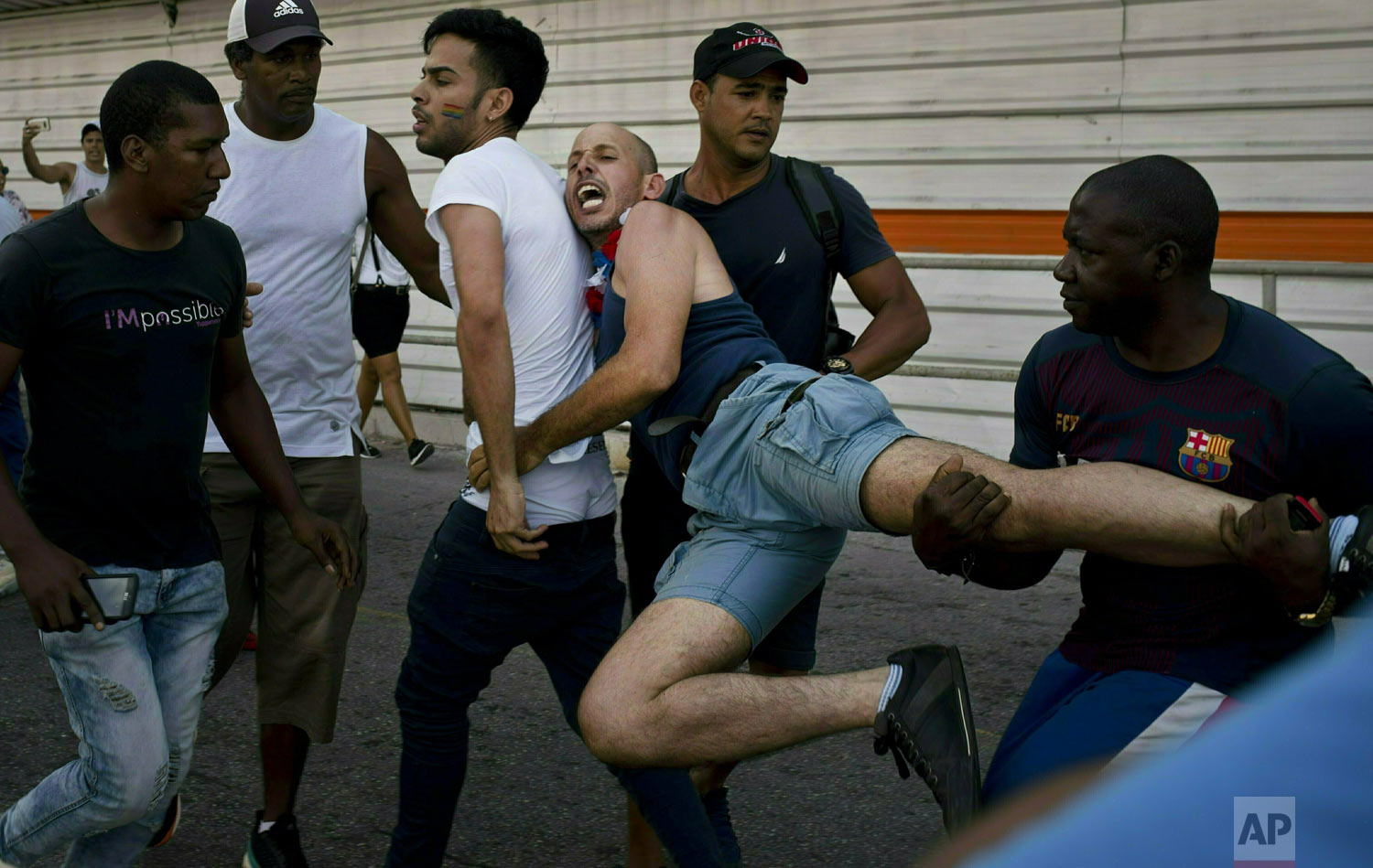  Police detain a gay rights activist taking part in an unauthorized march in Havana, Cuba, Saturday, May 11, 2019. The march was organized using Cuba's new mobile internet, with activists and supporters calling for a rally over Facebook and WhatsApp 