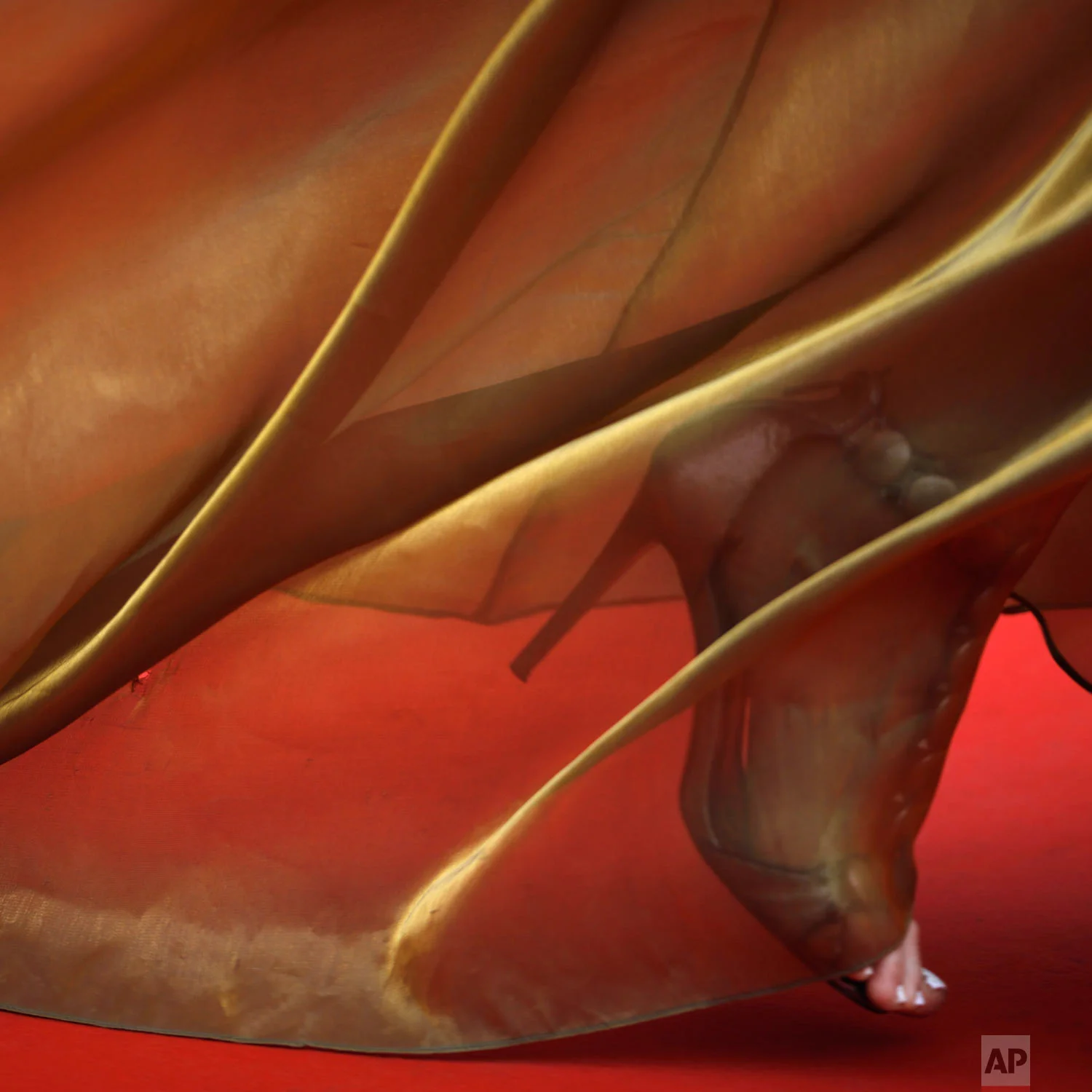 A woman walks on the carpet upon arrival at the opening ceremony and the premiere of the film 'The Dead Don't Die' at the 72nd international film festival, Cannes, southern France, May 14, 2019. (AP Photo/Petros Giannakouris)
