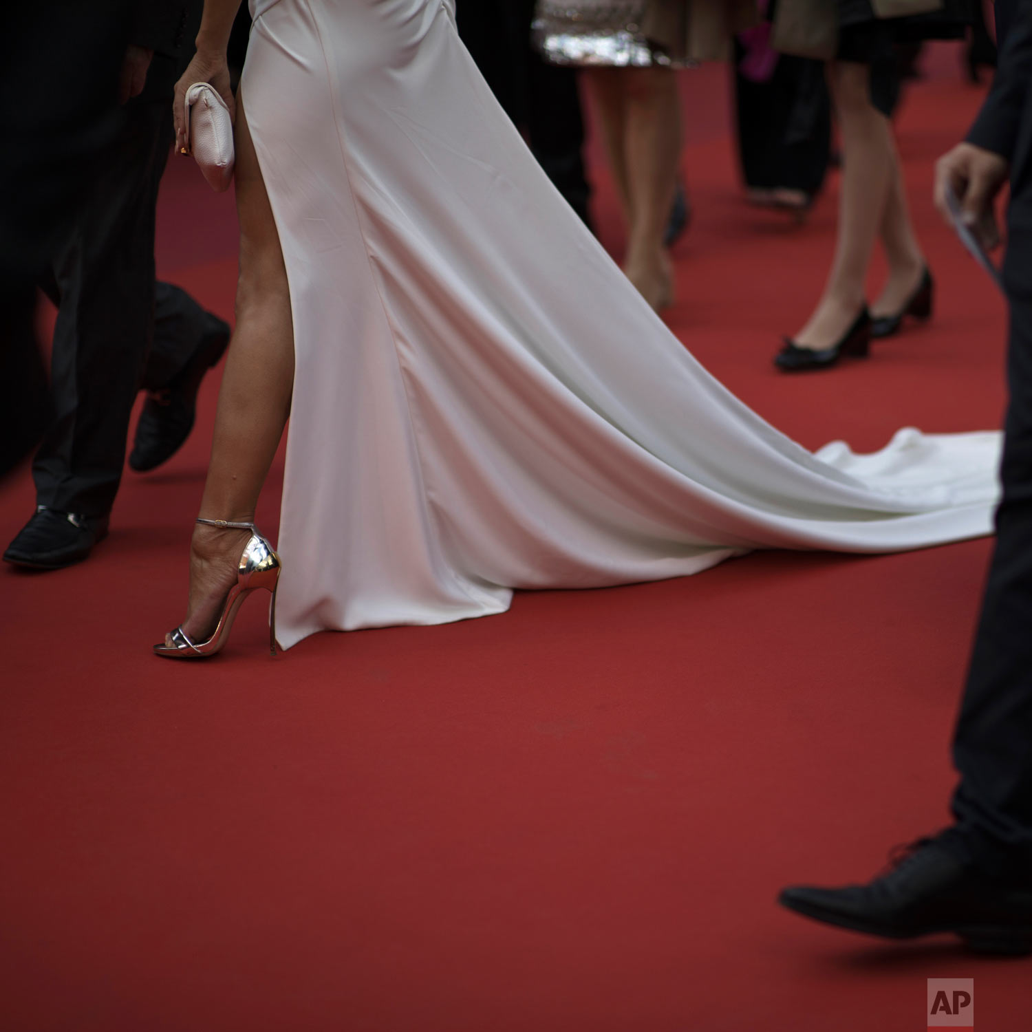 A woman walks the red carpet at the premiere of the film 'Les Miserables' at the 72nd international film festival, Cannes, southern France, May 15, 2019. (AP Photo/Petros Giannakouris)