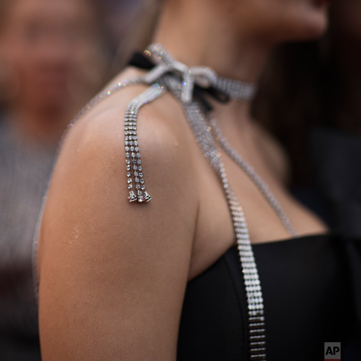 A woman poses for photographers upon arrival at the premiere of the film 'A Hidden Life' at the 72nd international film festival, Cannes, southern France, May 19, 2019. (AP Photo/Petros Giannakouris)