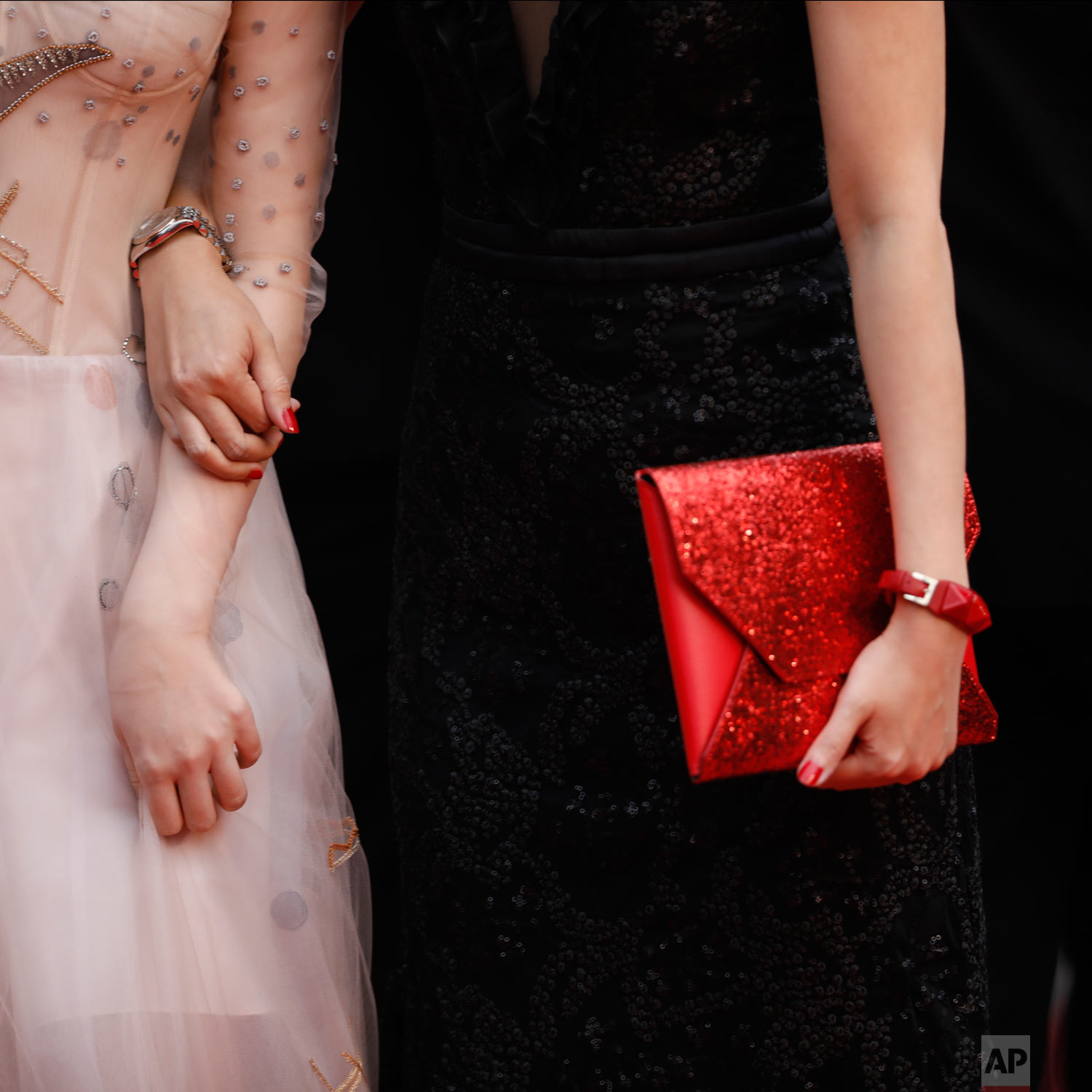 Women walk on the carpet upon arrival at the opening ceremony and the premiere of the film 'The Dead Don't Die' at the 72nd international film festival, Cannes, southern France, May 14, 2019. (AP Photo/Petros Giannakouris)