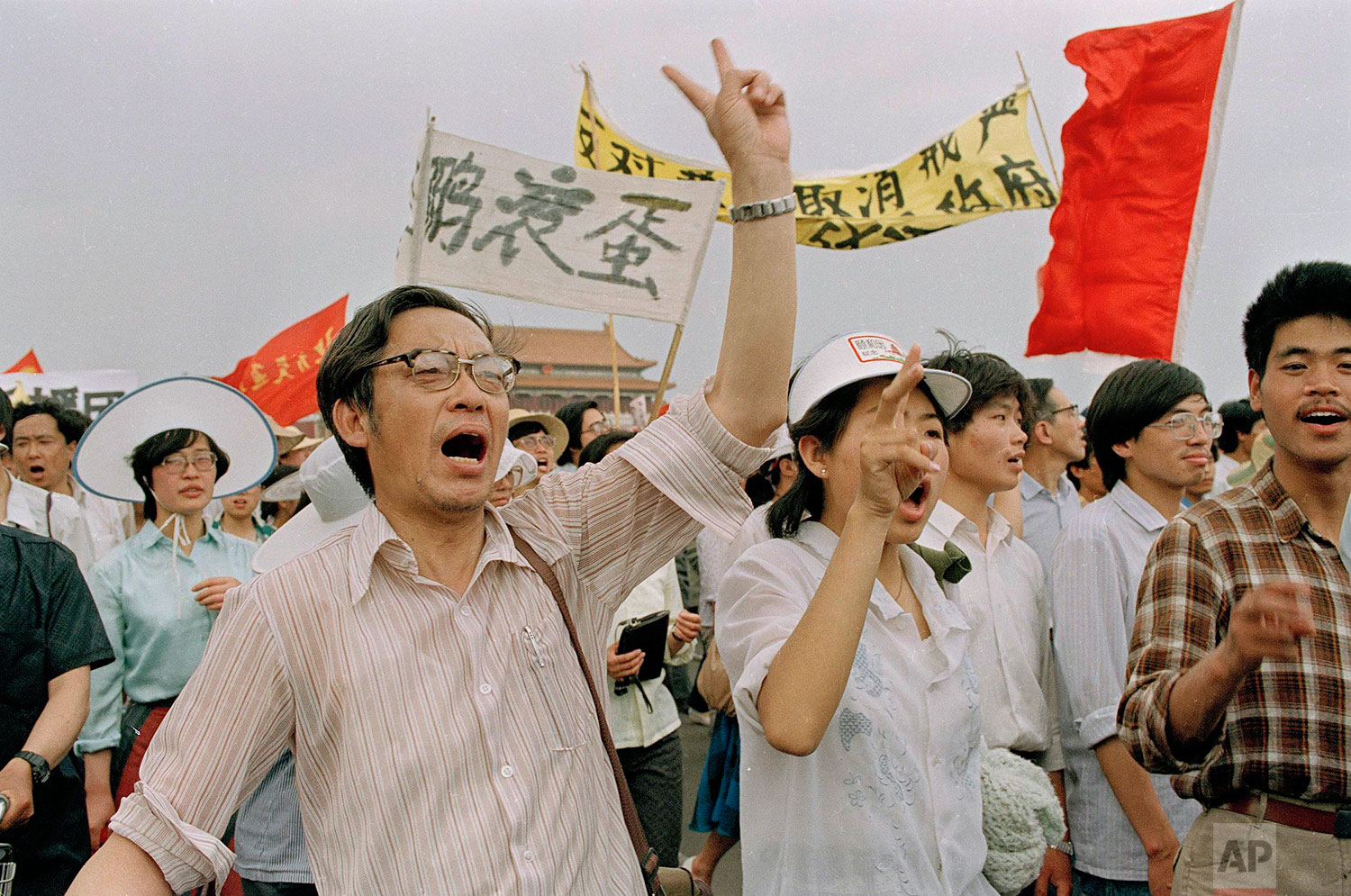  Protesters from all walks of life and all age groups march for democracy in the streets of Beijing near Tiananmen Square, May 23, 1989. (AP Photo/Jim Palmer) 