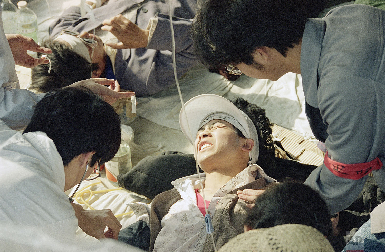  A striking Beijing University student is given first aid by medics at a field hospital in Tiananmen Square at Beijing, Wednesday, May 17, 1989, the fourth day of their hunger strike for democracy. (AP Photo/Sadayuki Mikami) 