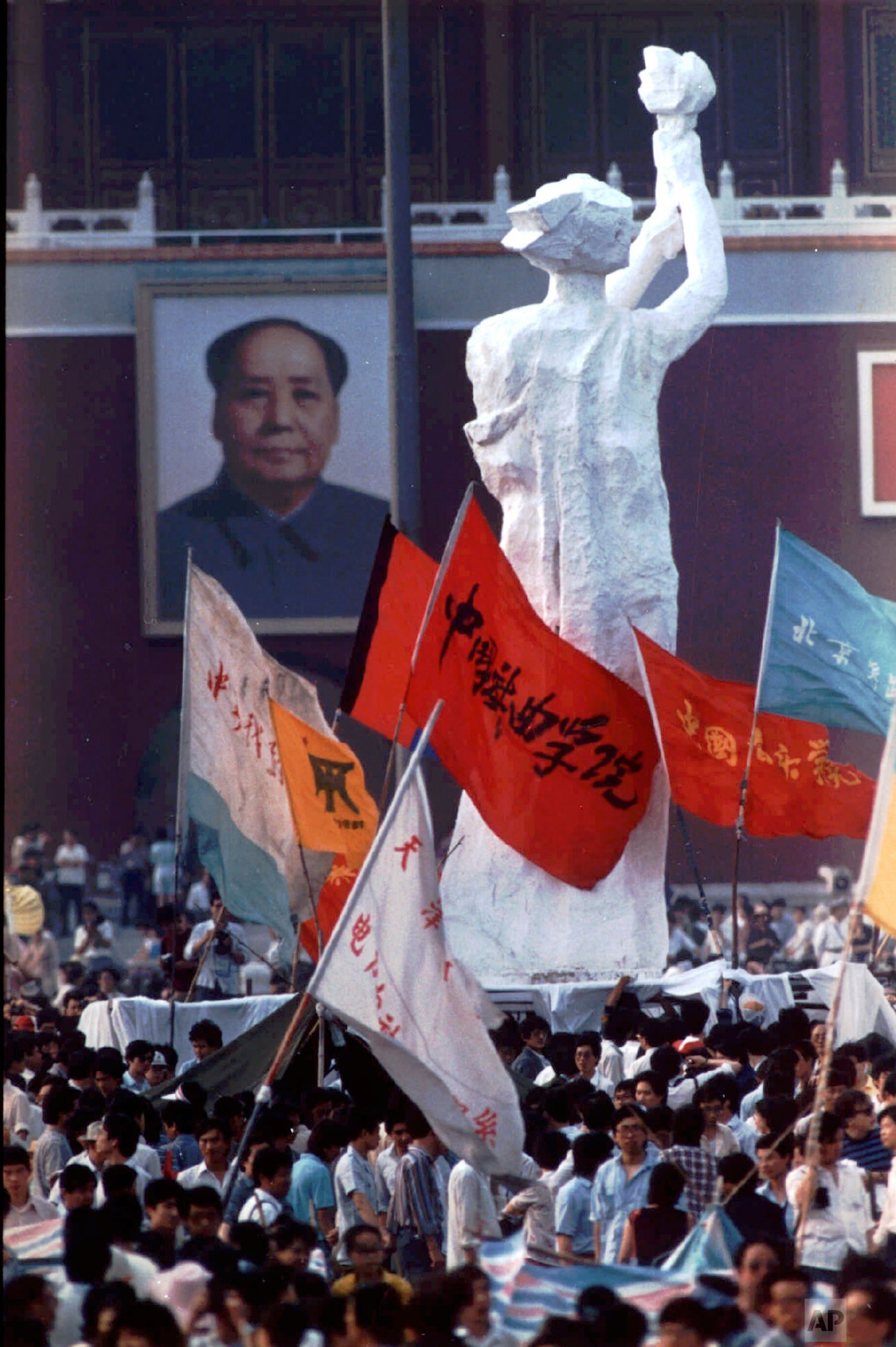  In this May 30, 1989 file photo, the portrait of Mao Zedong faces off a statue dubbed "The Goddess of Democracy" by students from the Central Academy of Fine Arts, who modeled it after the Statue of Liberty, during the student protest on Tiananmen S