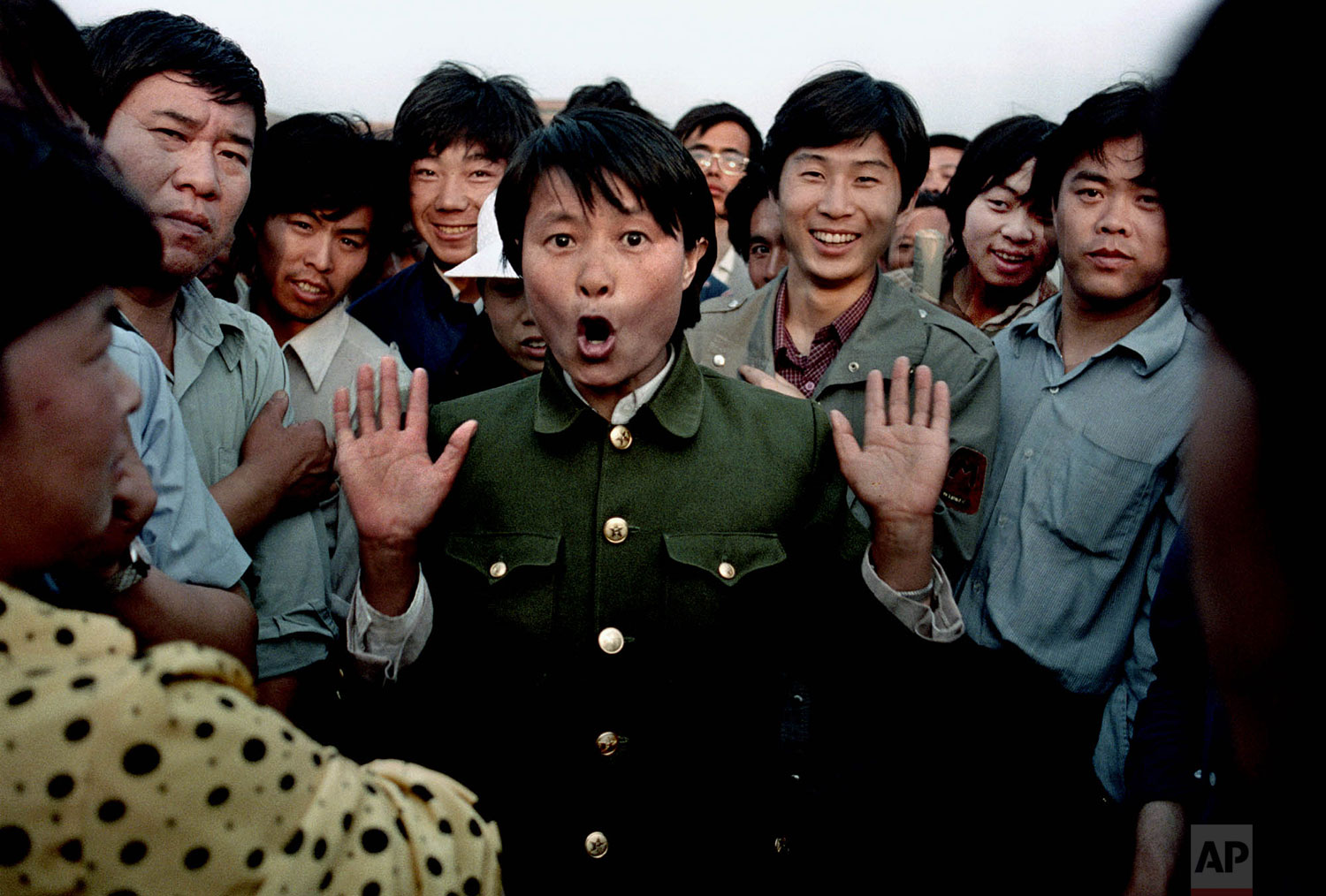  A woman soldier sings among pro-democracy protesters occupying Beijing's Tiananmen Square, about June 2, 1989. Police and military would occasionally mix with protesters in an attempt to keep the demonstration peaceful. In the early morning hours of