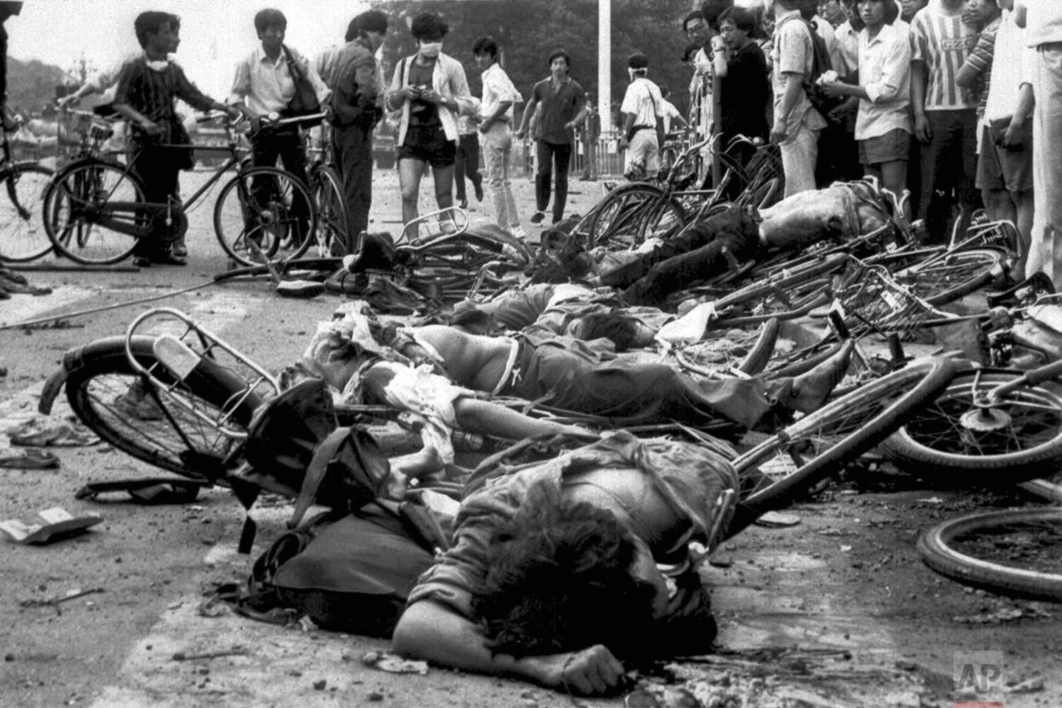  WARNING: GRAPHIC CONTENT  The bodies of dead civilians lie among mangled bicycles near Beijing's Tiananmen Square in this June 4, 1989 file photo. A leading pro-Beijing lawmaker in Hong Kong insisted that Chinese troops did not massacre people durin