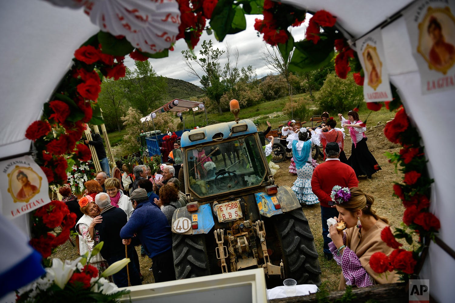Devotees of the Rocio Virgin take part in the "Romeria de El Rocio" in the countryside outside Fitero, northern Spain, May 25, 2019. (AP Photo/Alvaro Barrientos)