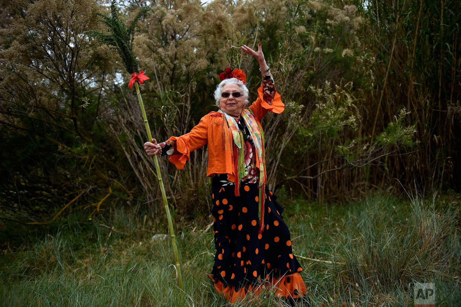 Joaquina Almellones, a devote of the Rocio Virgin, poses while taking part in the "Romeria de El Rocio” outside Fitero, Spain, May 25, 2019. (AP Photo/Alvaro Barrientos)