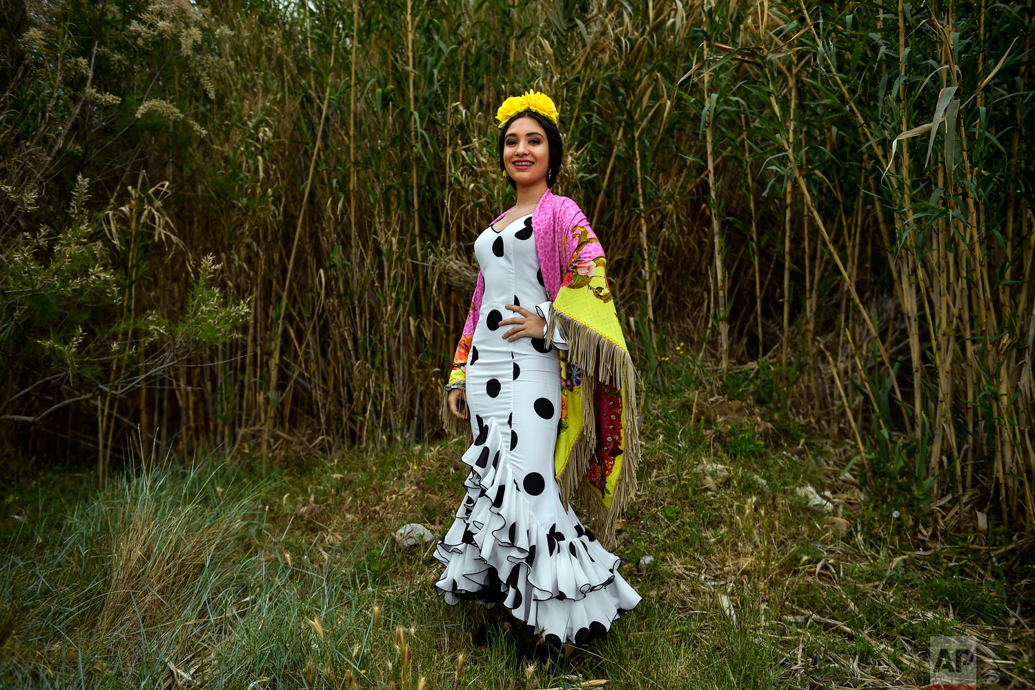 Melena Garro, a devote of the Rocio Virgin, poses while taking part in the "Romeria de El Rocio" in the countryside outside Fitero, northern Spain, May 25, 2019. (AP Photo/Alvaro Barrientos)