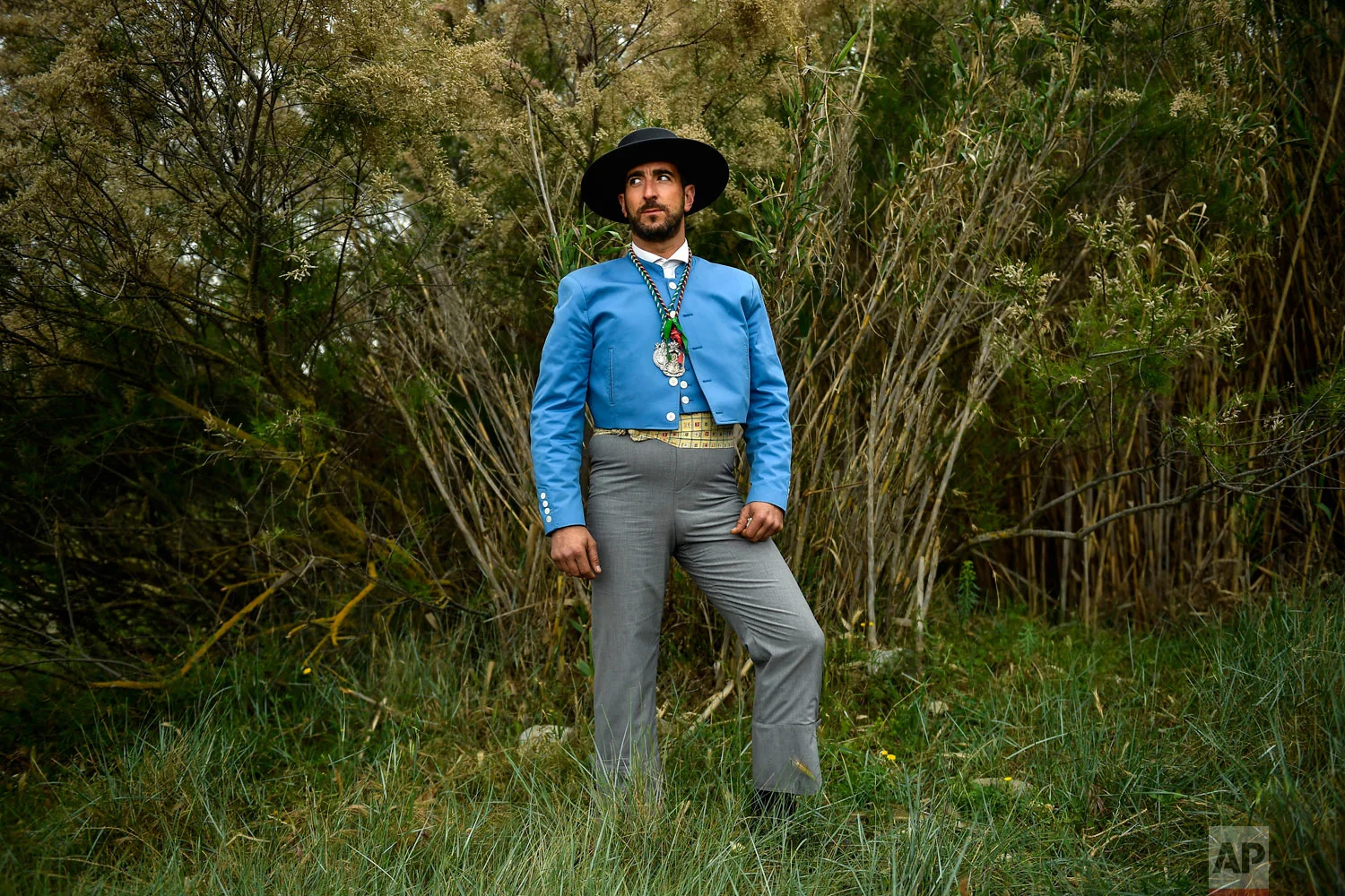 Alberto Simon, a devote of the Rocio Virgin, poses while taking part in the "Romeria de El Rocio" outside Fitero, northern Spain, Saturday, May 25, 2019. (AP Photo/Alvaro Barrientos)