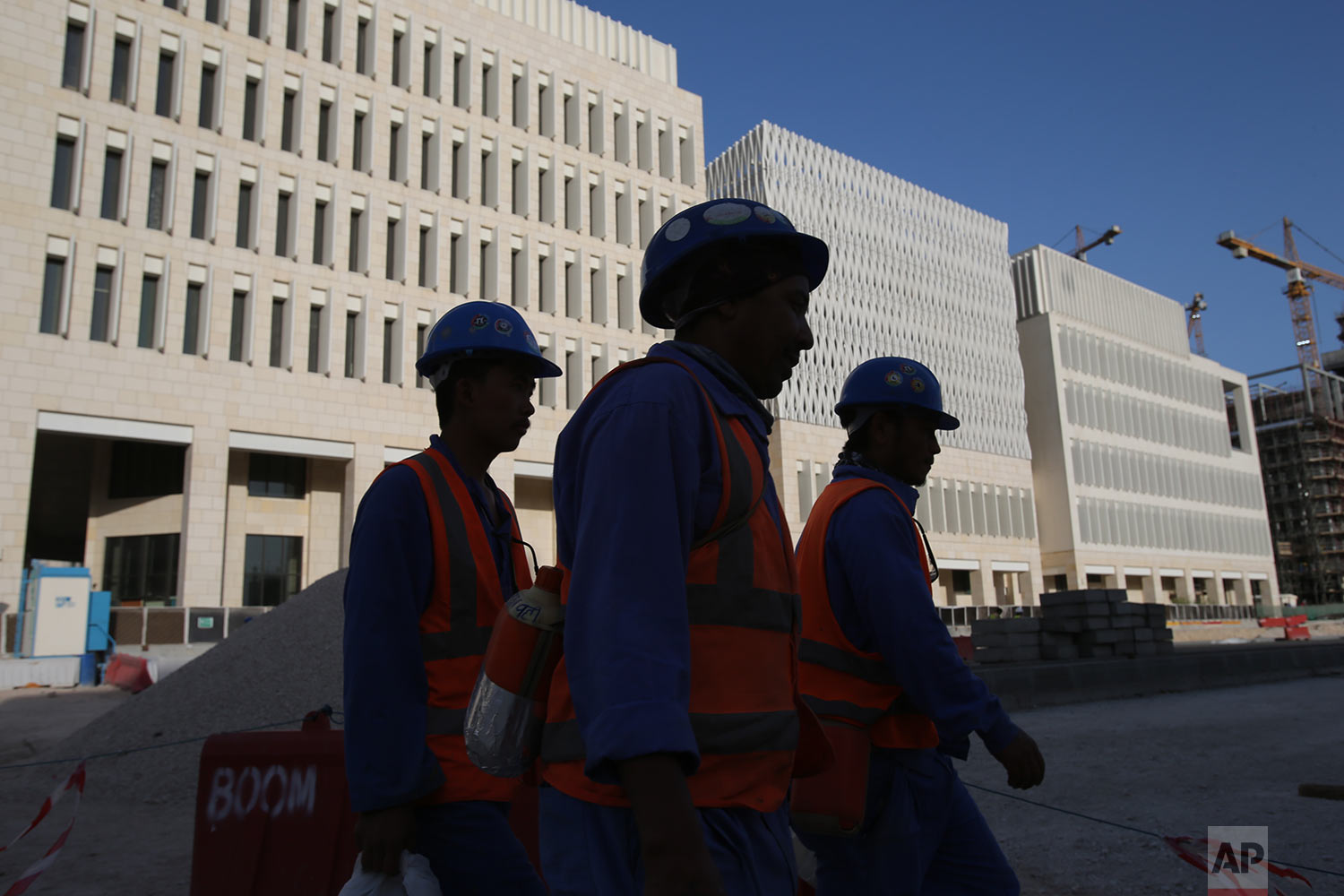  In this Tuesday, April 23, 2019 photo, labours leave their construction sites at the Msheireb Downtown Doha district in Doha, Qatar. (AP Photo/Kamran Jebreili) 