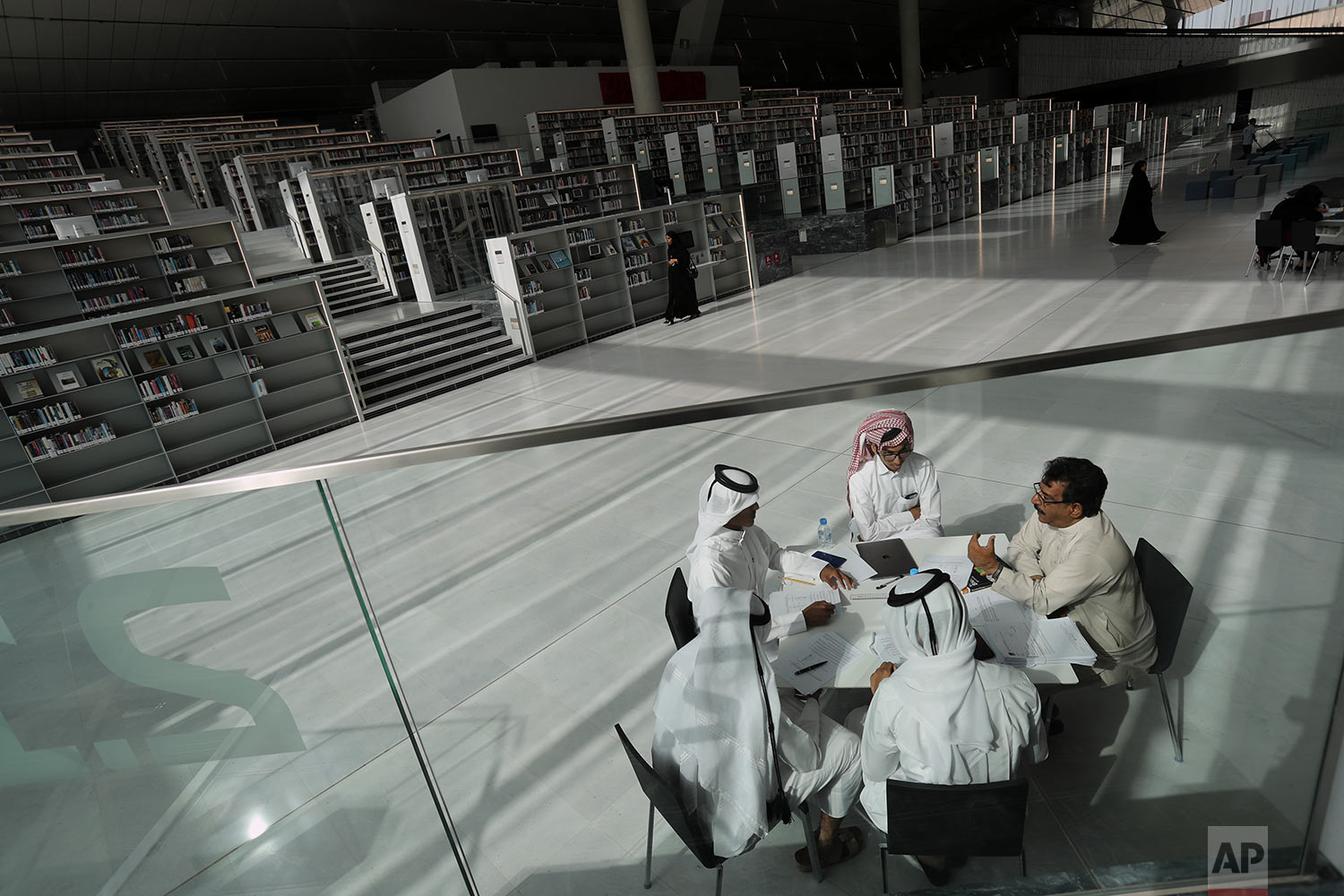 In this Tuesday, April 30, 2019 photo, a few students listen to their professor at the Qatar National Library in Doha, Qatar. (AP Photo/Kamran Jebreili) 
