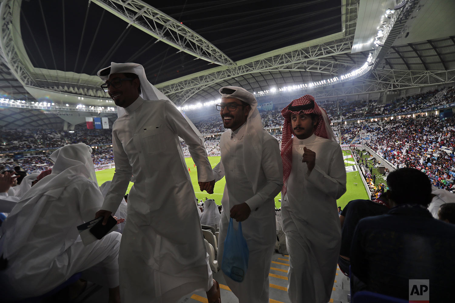  In this Thursday, May 16, 2019 photo, football fans leave their seats during the final match half-time at the inauguration ceremony of the Al Wakrah stadium in Doha, Qatar. (AP Photo/Kamran Jebreili) 