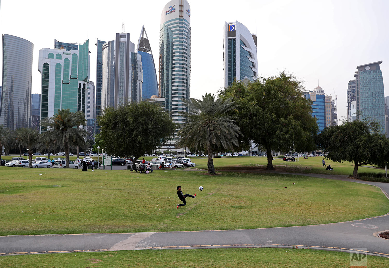  In this Saturday, May 4, 2019 photo, a boy plays football at Dafna park in Doha, Qatar. (AP Photo/Kamran Jebreili) 