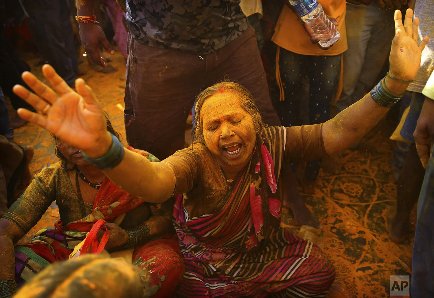 A devotee covered in turmeric goes into a trance during the celebration of the Bhandara Festival, or the Festival of Turmeric, at the Jejuri temple in Pune district, Maharashtra state, India, Monday, June 3, 2019. (AP Photo/Rafiq Maqbool)