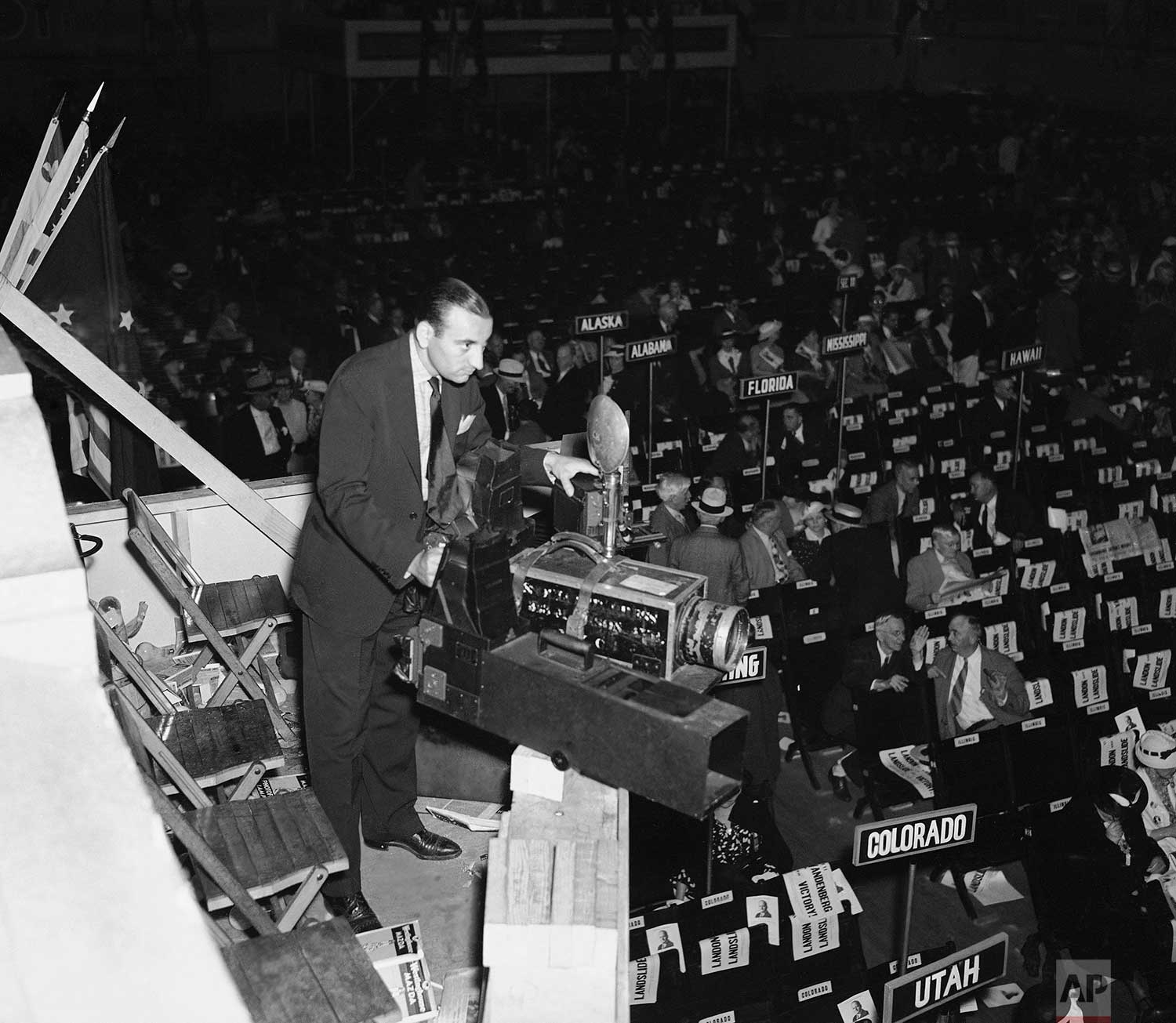 Associated Press photographer Murray Becker of New York takes a general view picture of the scene at the 1936 Republican National Convention in Cleveland, Ohio in the Public Auditorium, using a 28-inch camera, June 1936. (AP Photo)