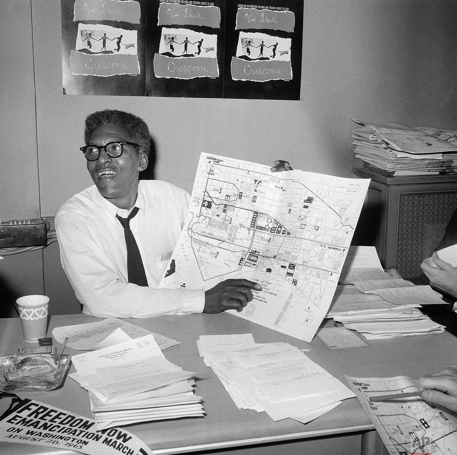 In this Aug. 24, 1963 file photo, Bayard Rustin points to a map showing the path of the March on Washington during a news conference at the New York City headquarters. Months before Martin Luther King Jr.'s "I Have a Dream" declaration galvanized a