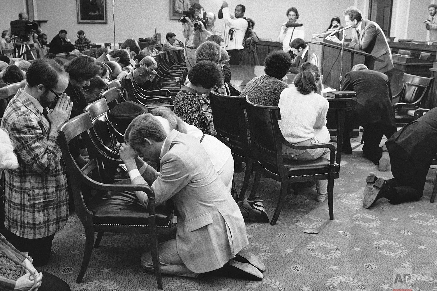 In this Sunday, Oct. 14, 1979 file photo, a group calling themselves the "Ad-Hoc Committee for the National Day of Prayer on Homosexuality" are led in prayer by Paul Cates at a gathering on Capitol Hill in Washington. The group stated they intended to pray for the repentance of homosexuals. The gathering coincided with a Washington rally by gay organizations. (AP Photo/Thumma)