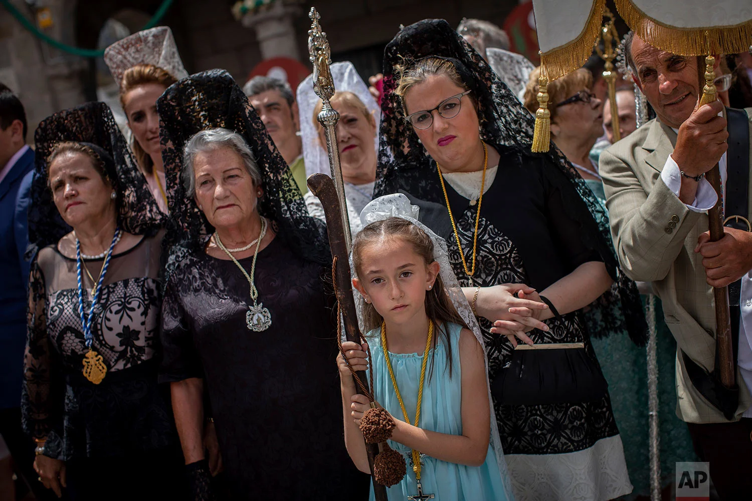 Catholic worshippers take part during the Corpus Christi procession in the village of Bejar, Spain, Sunday, June 23, 2019. (AP Photo/Bernat Armangue)