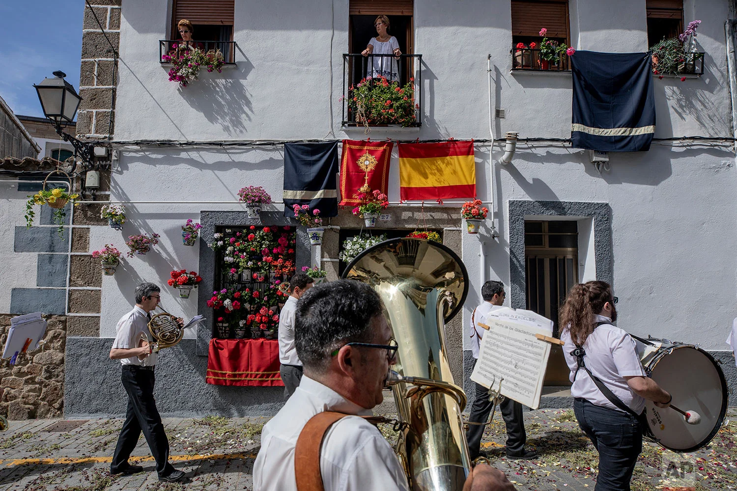 A music band takes part during the Corpus Christi procession in the village of Bejar, Spain, Sunday, June 23, 2019. (AP Photo/Bernat Armangue)
