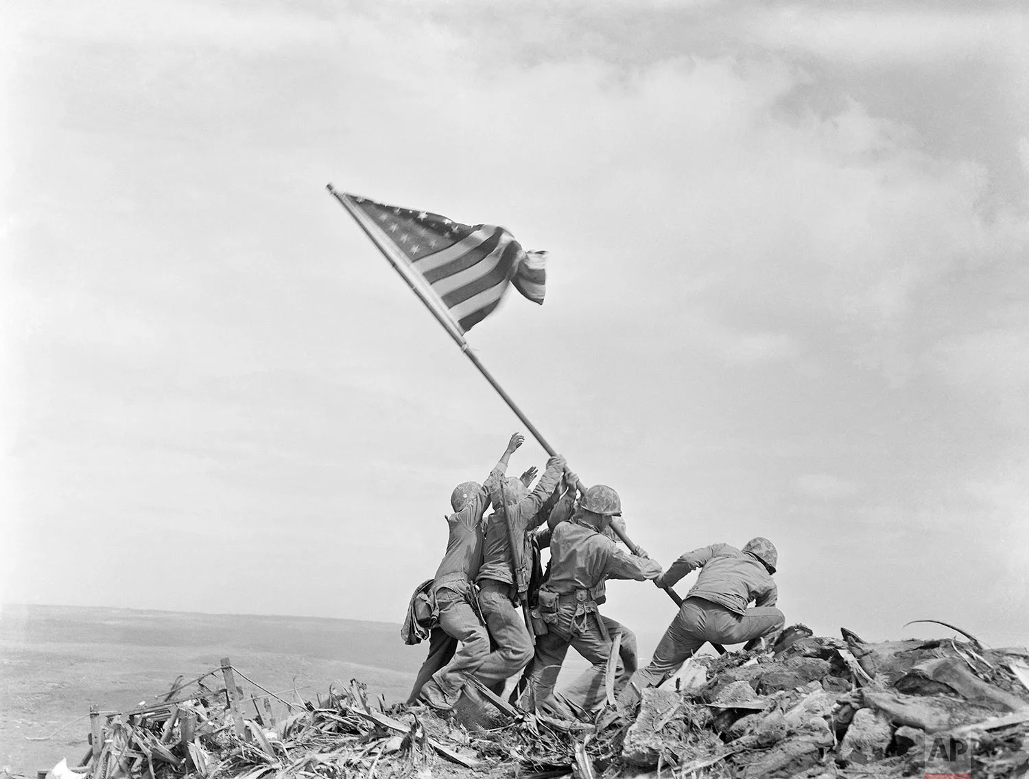 U.S. Marines of the 28th Regiment, 5th Division, raise the American flag atop Mt. Suribachi, Iwo Jima, Japan, Feb 23, 1945. (AP Photo/Joe Rosenthal)