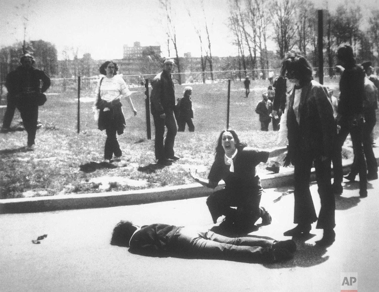 Mary Ann Vecchio cries out as she kneels next to the body of student Jeffrey Miller lying face down on the campus of Kent State University, Kent, Ohio, May 4, 1970. National Guardsmen killed four when they fired into a crowd of demonstrators protesting the U.S. bombing of Cambodia. (AP Photo/John Filo)