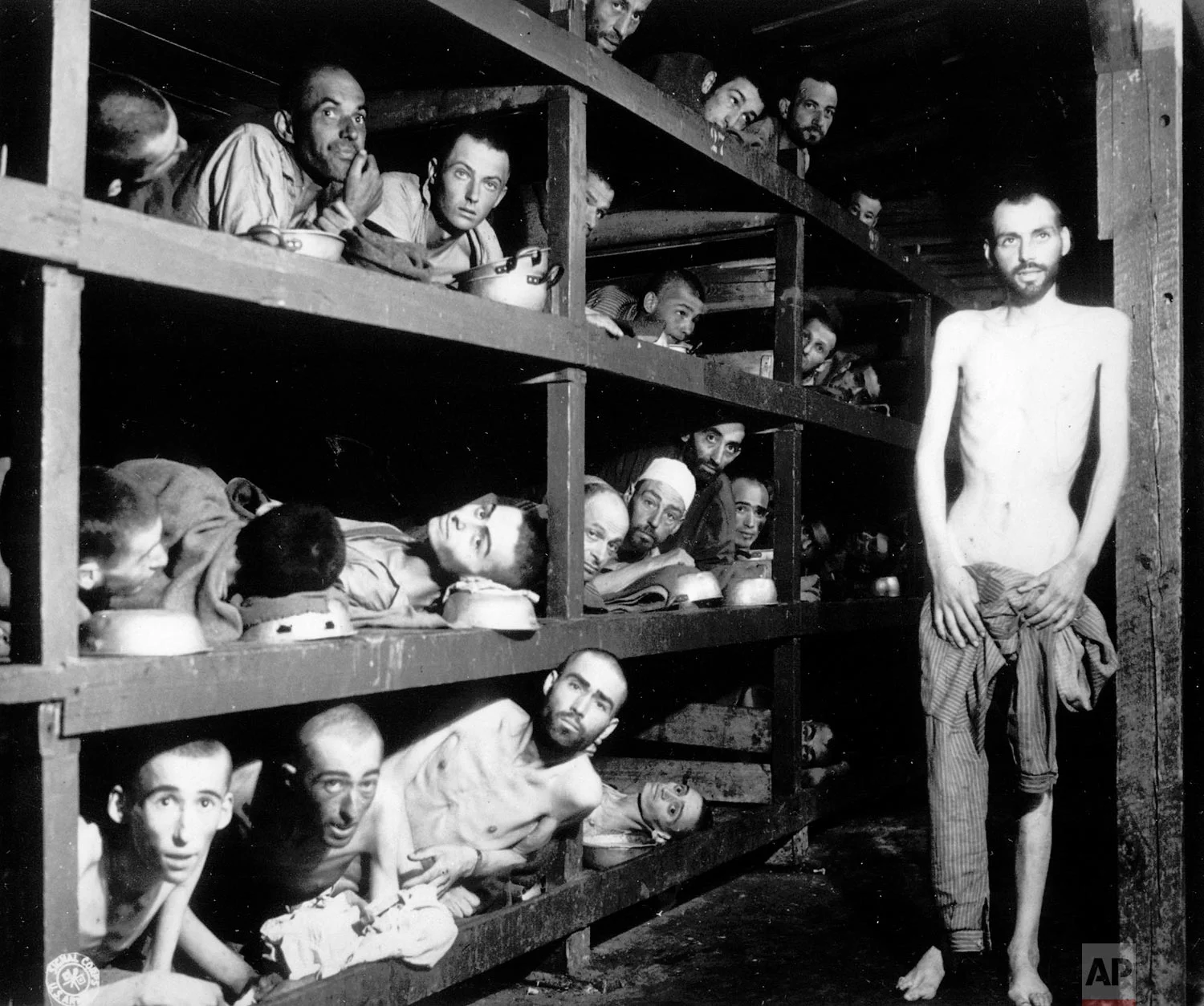 Inmates of the German KZ Buchenwald are seen inside their barracks a few days after U.S troops liberated the concentration camp near Weimar, Germany, April 16, 1945. An estimated 56,000 perished at Buchenwald, most Jews worked to death, shot or hanged by Nazi guards. (AP Photo)