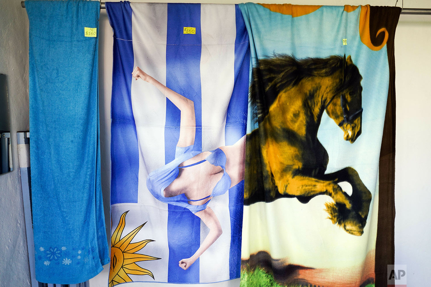 Towels are displayed for sale at a clothing store run by an inmate at the Punta de Rieles prison, in Montevideo, Uruguay, May 15, 2019. The inmate who runs this business also studies economics at the university. (AP Photo/Matilde Campodonico)