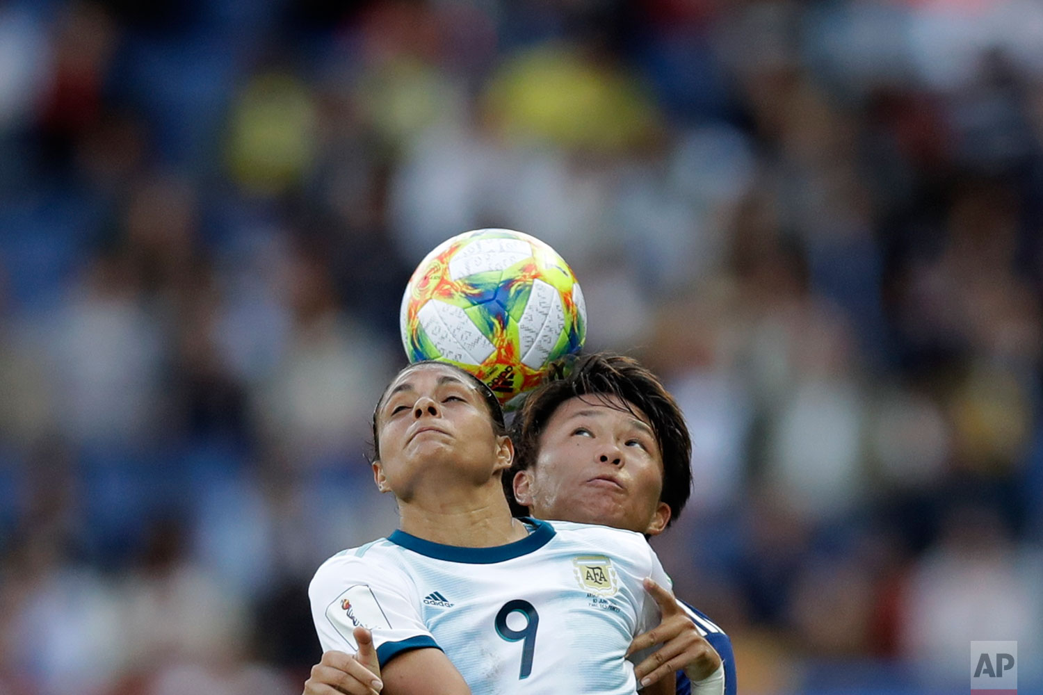 Argentina's Sole Jaimes, left, fights for a high ball with Japan's Moeka Minami during the Women's World Cup Group D soccer match between Argentina and Japan at the Parc des Princes in Paris, Monday, June 10, 2019. (AP Photo/Alessandra Tarantino)