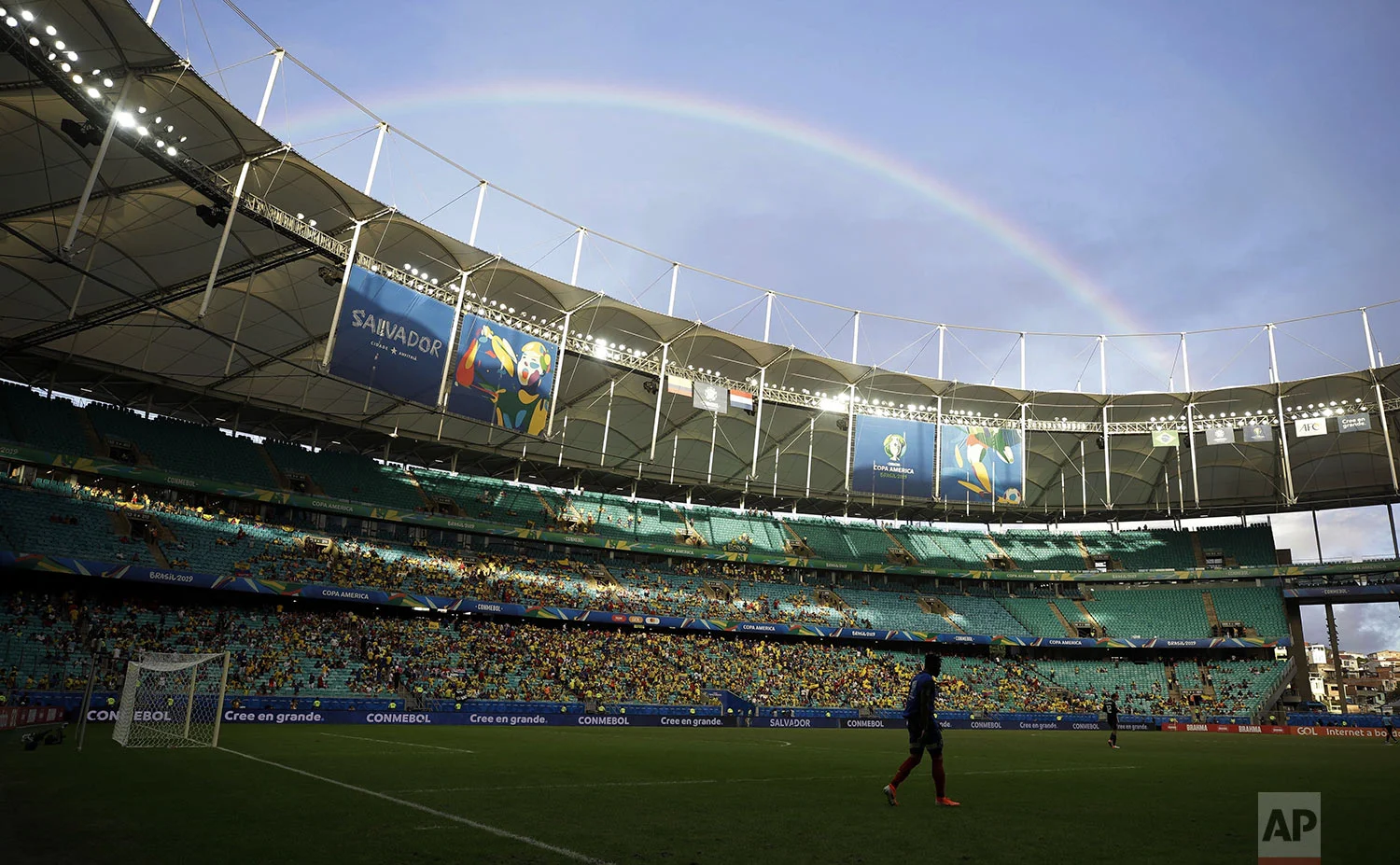 A rainbow appears in the sky at the end of the first half of a Copa America Group B soccer match between Colombia and Paraguay at Arena Fonte Nova in Salvador, Brazil, Sunday, June 23, 2019. Colombia beat Paraguay 1-0 Sunday with a second-string team to stay perfect at the Copa America with three wins and without conceding any goals. (AP Photo/Ricardo Mazalan)