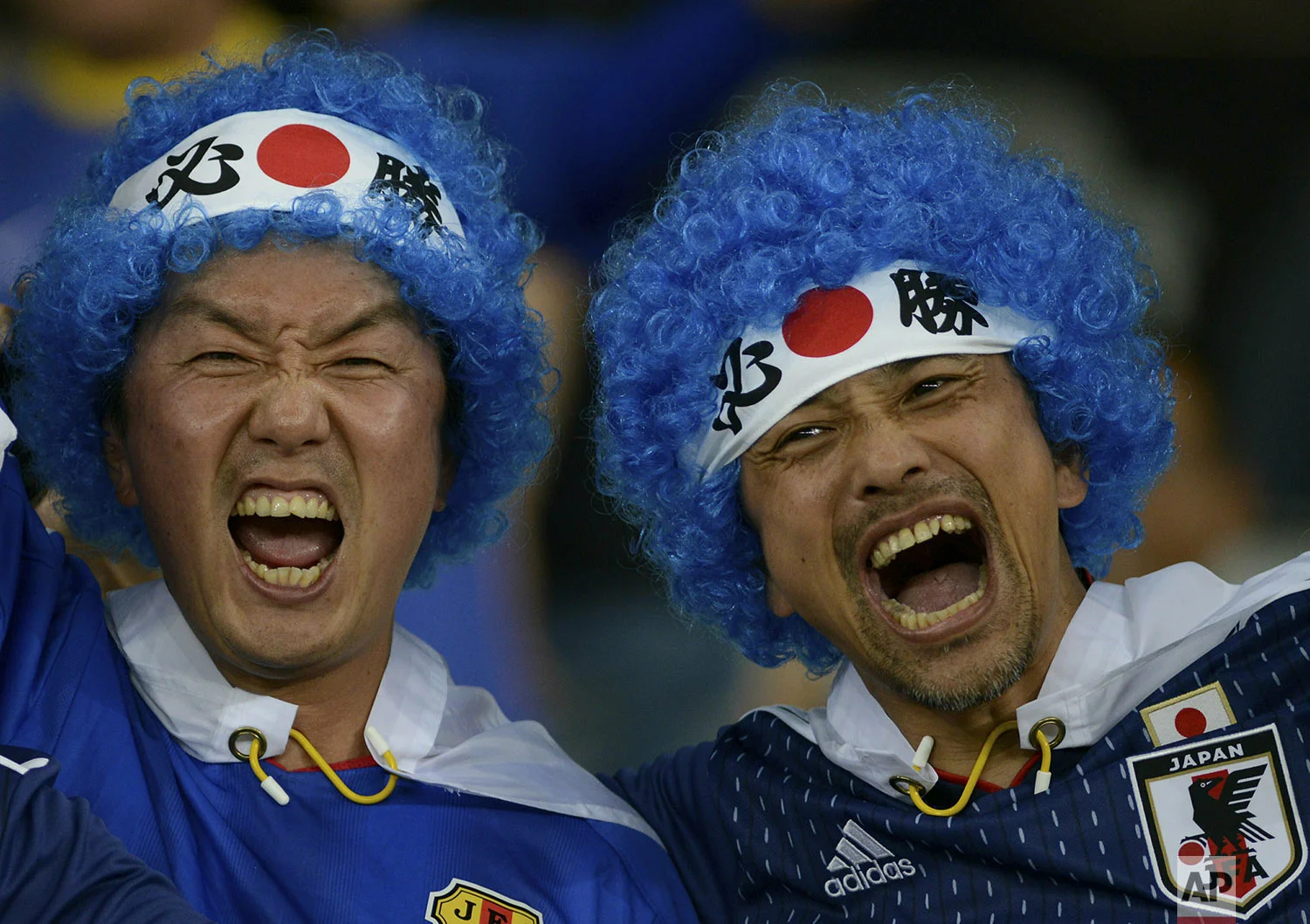 Japan soccer fans cheer prior to their team's Copa America Group C soccer match against Ecuador at Mineirao stadium in Belo Horizonte, Brazil, Monday, June 24, 2019. (AP Photo/Eugenio Savio)
