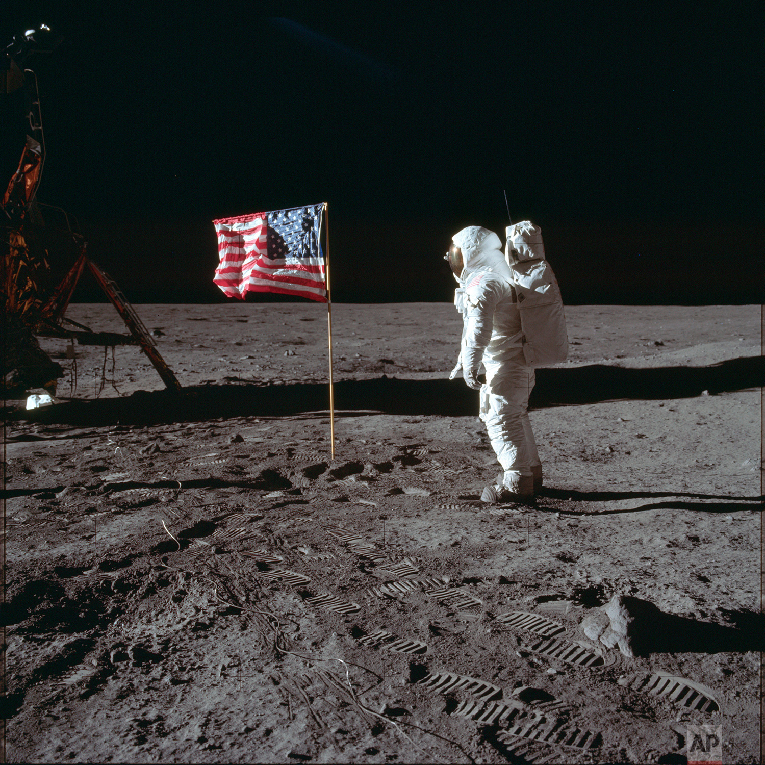  In this July 20, 1969 photo made available by NASA, astronaut Buzz Aldrin Jr. poses for a photograph beside the U.S. flag on the moon during the Apollo 11 mission. Aldrin and fellow astronaut Neil Armstrong were the first men to walk on the lunar su