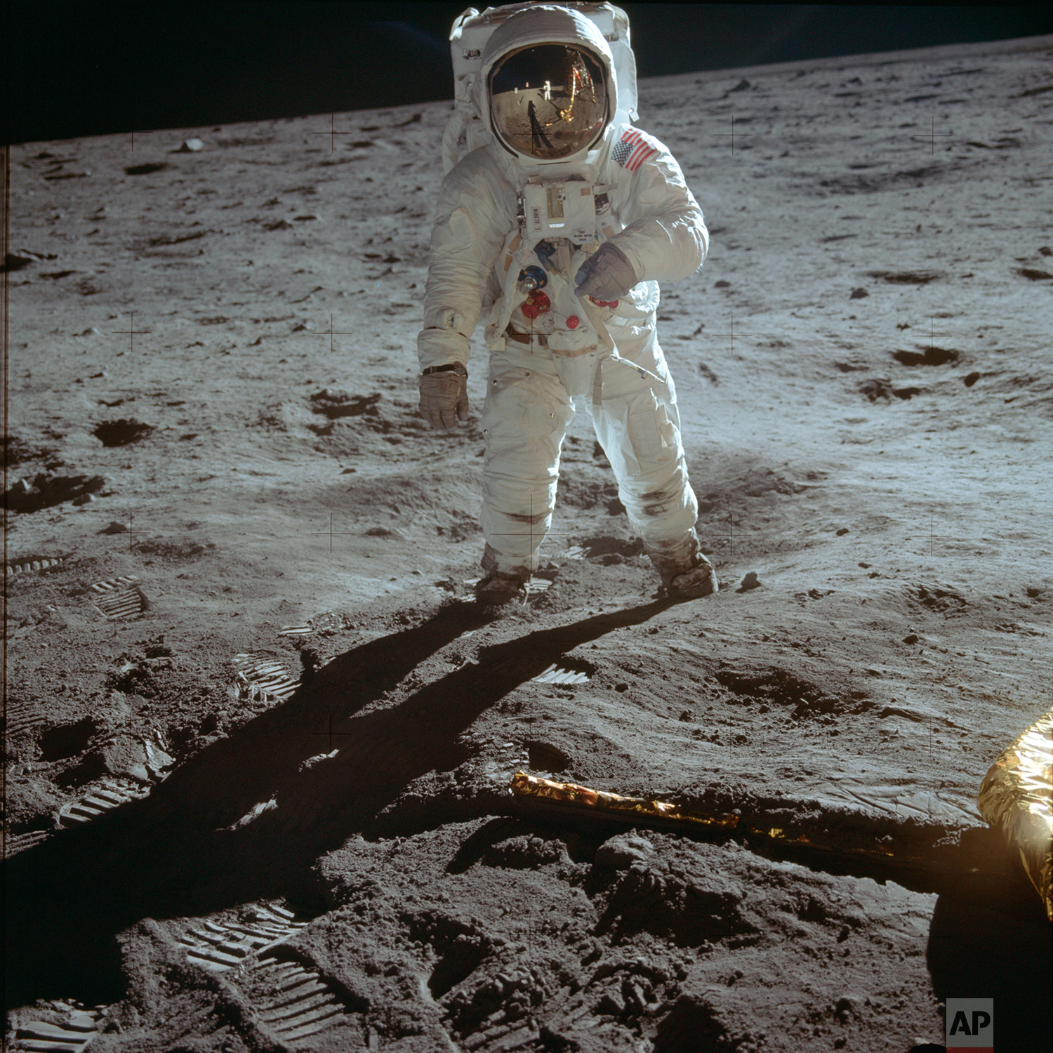  In this July 20, 1969 photo made available by NASA, astronaut Buzz Aldrin, lunar module pilot, walks on the surface of the moon near the leg of the Lunar Module "Eagle" during the Apollo 11 extravehicular activity. (Neil Armstrong/NASA via AP) 