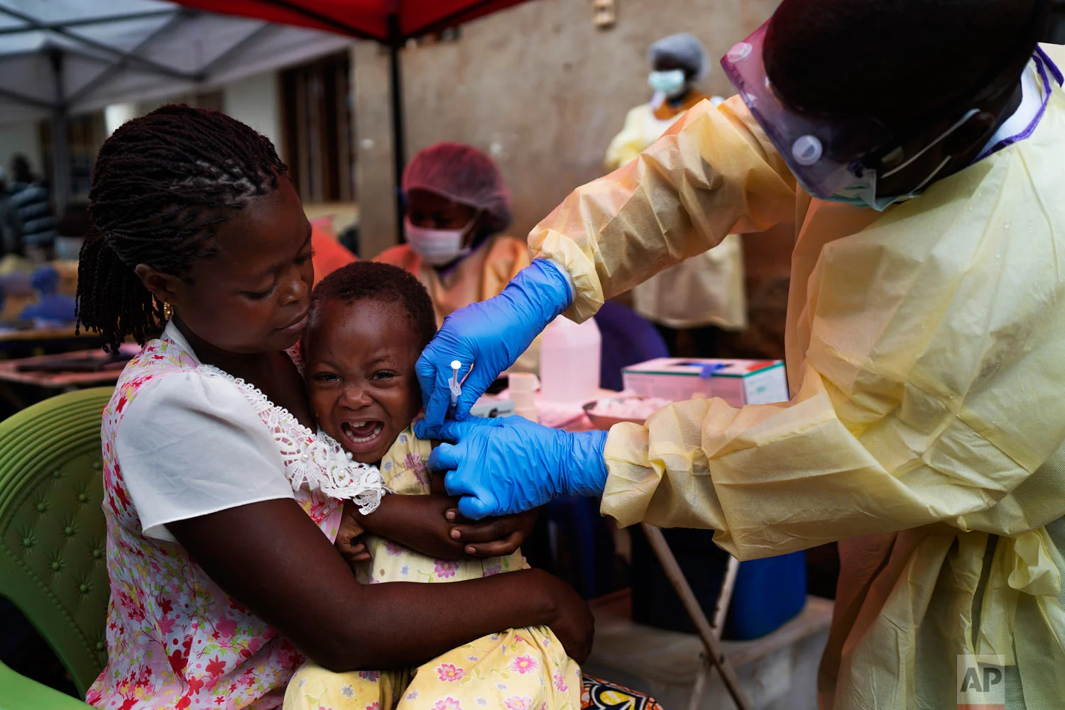 A child is vaccinated against Ebola in Beni, Congo on July 13 2019. (AP Photo/Jerome Delay)
