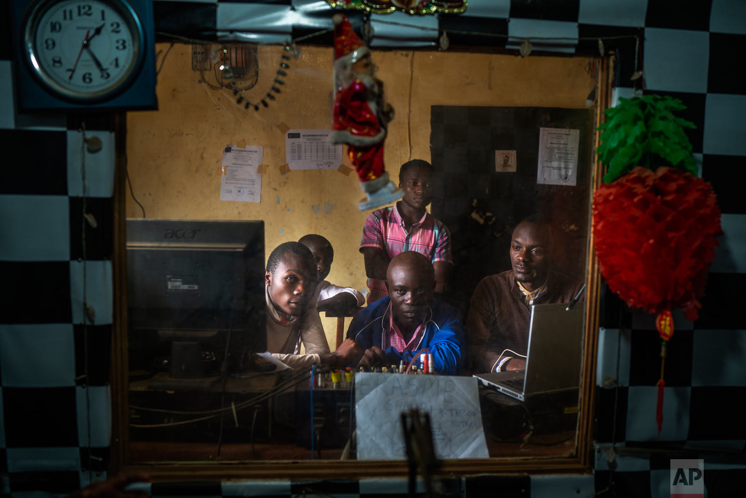 Congolese journalists broadcast an Ebola awareness program from a local radio station in Beni, Congo, July 13, 2019. (AP Photo/Jerome Delay)