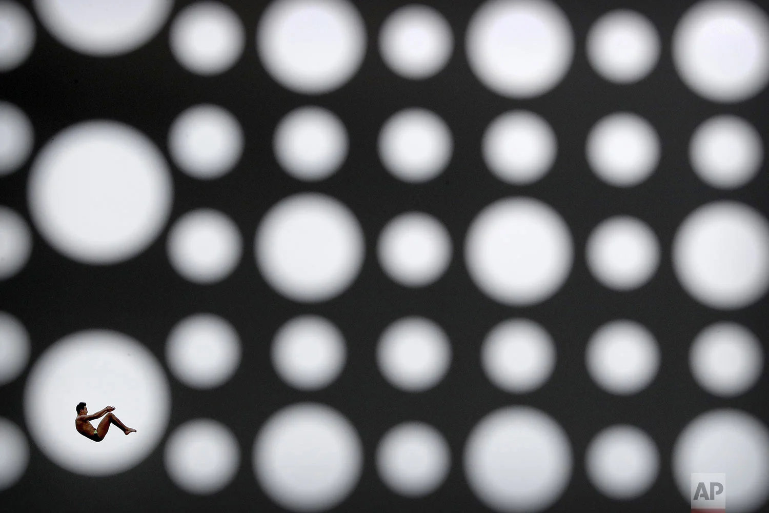 Viacheslav Kolesnikov, of Ukraine, dives during the men's high diving competition at the World Swimming Championships in Gwangju, South Korea, July 24, 2019. (AP Photo/Mark Schiefelbein)