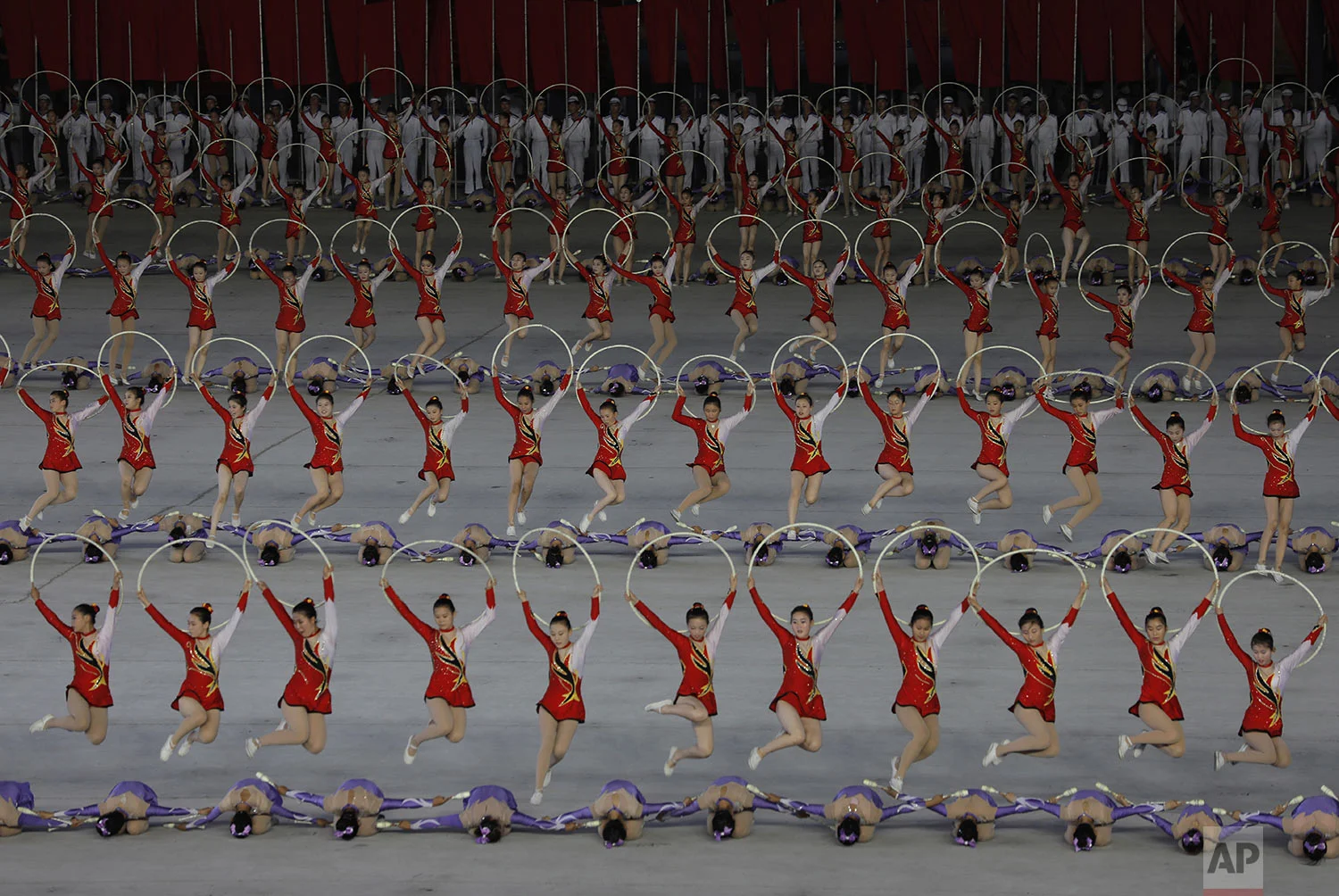 North Koreans perform during a mass game performance of "The Land of the People" at the May Day Stadium in Pyongyang, North Korea, Tuesday, July 16, 2019. (AP Photo/Vincent Yu)