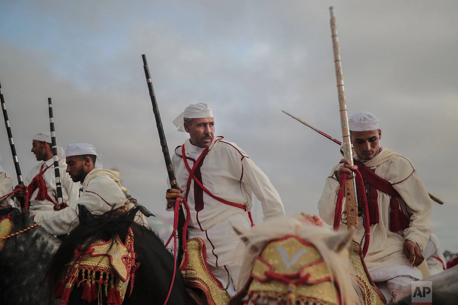 A troupe reacts after finishing a run during Tabourida, a traditional horse riding show also known as Fantasia, in the coastal town of El Jadida, Morocco, July 25, 2019. (AP Photo/Mosa'ab Elshamy)