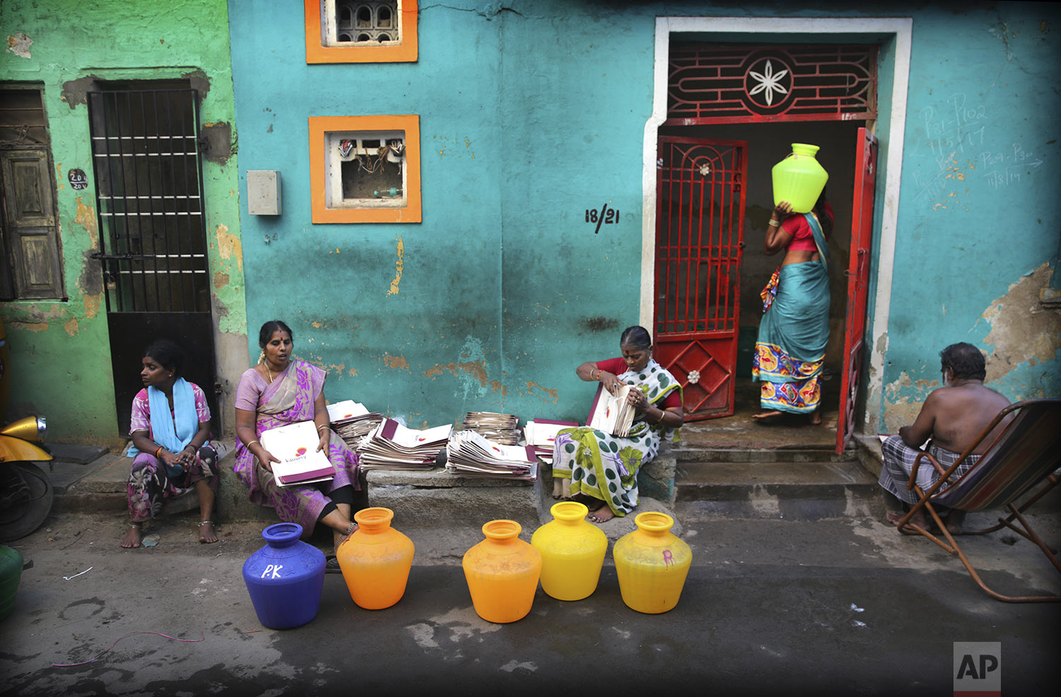 Residents fill drinking water from a water truck in Chennai in Southern Indian state of Tamil Nadu, Monday, July 15, 2019. (AP Photo/Manish Swarup)