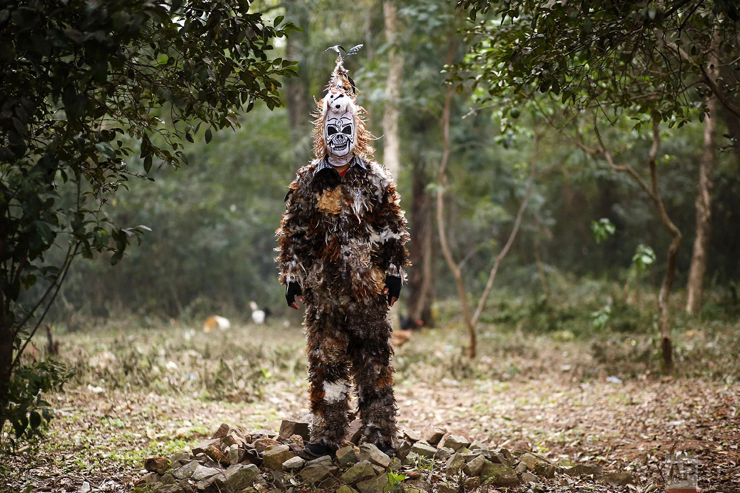 Cristian Riveros poses for a portrait dressed in bird feathers during the St. Francis Solano celebrations in Emboscada, Paraguay, Wednesday, July 24, 2019. Riveros has been paying a promise to St. Francis Solano since he recovered from an operation at age 13. St. Francis Solano, who was born in Spain in 1549, died in Peru in 1610. He was canonized in 1726. (AP Photo/Jorge Saenz)