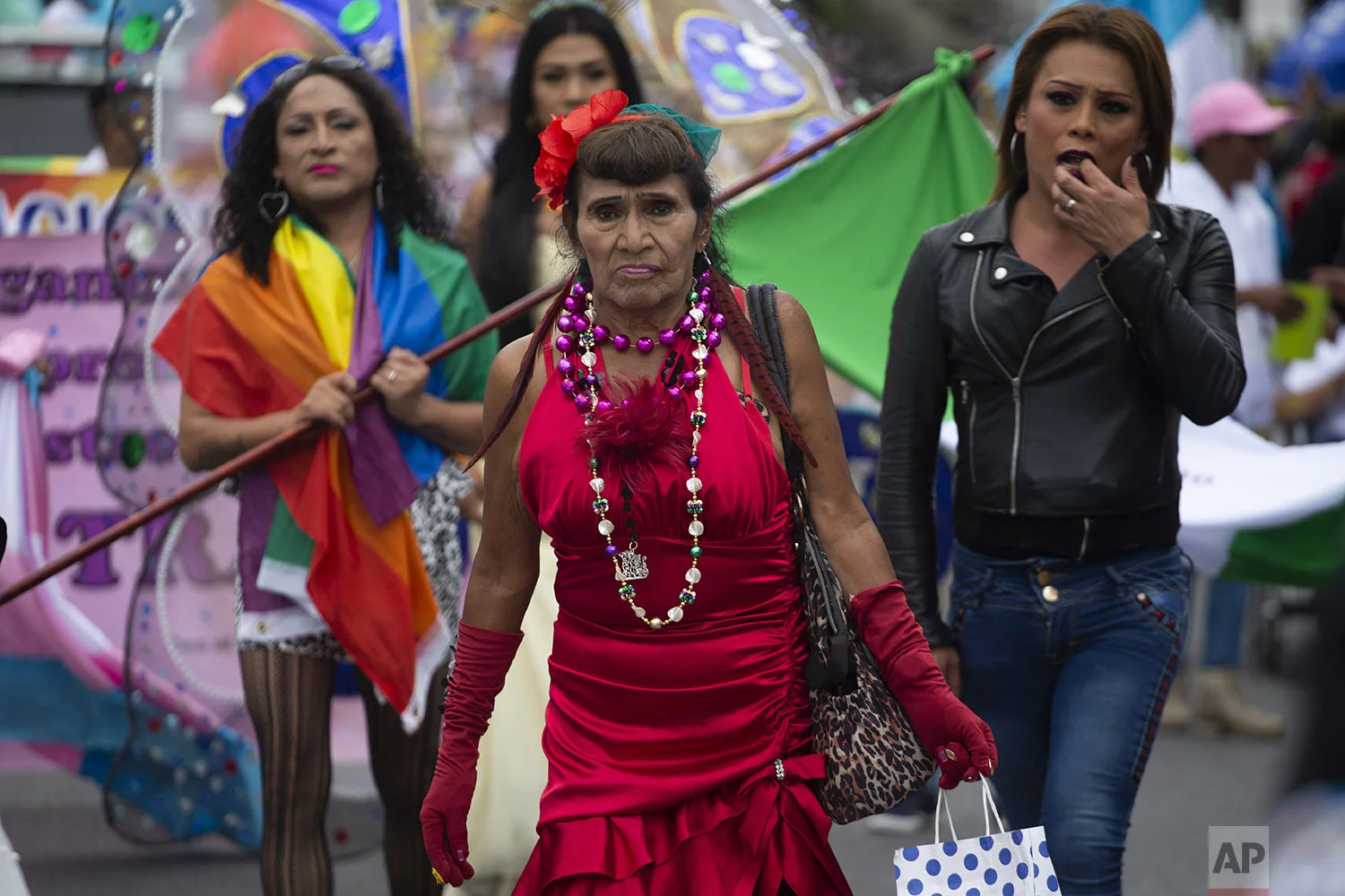 Revelers take part in the annual Gay Pride parade in Guatemala City's historical center, July 20, 2019. (AP Photo/Moises Castillo)